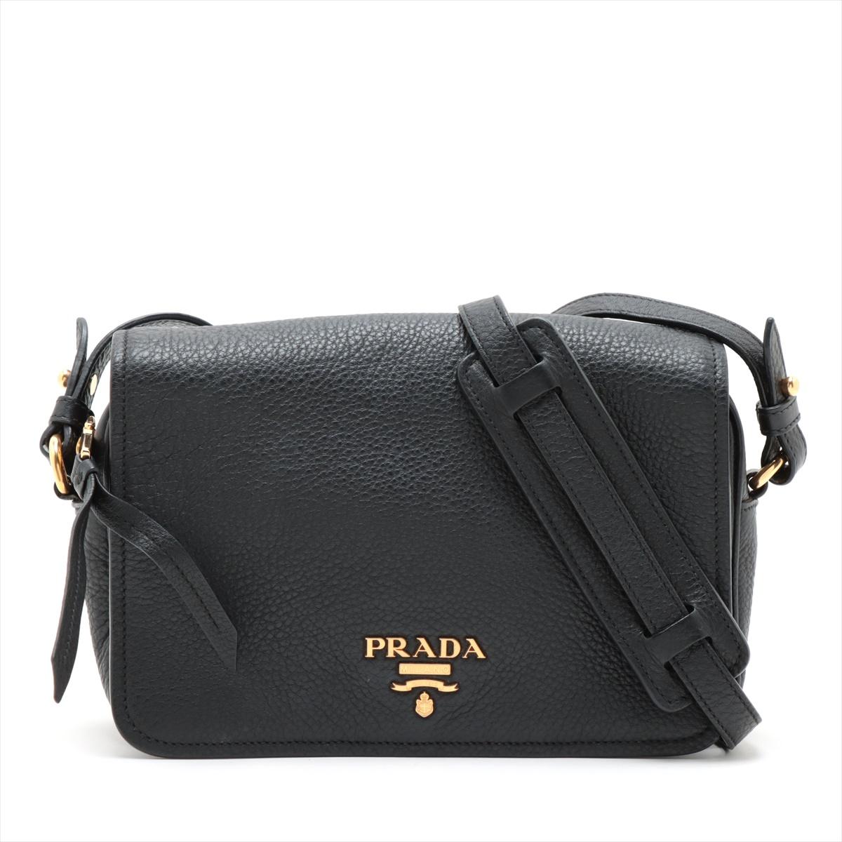 *will ship around 11/15

The Prada Vitello Leather Shoulder Bag in black is a sleek and versatile accessory that combines timeless style with functionality. Crafted from premium Vitello leather, the bag features a flap closure and is adorned with