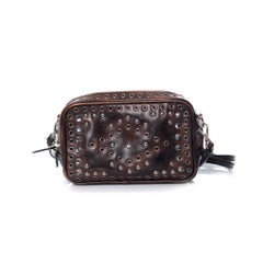 Prada, Vitello vintage embellished camera messenger bag.
