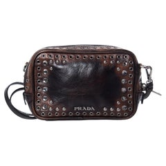 Prada, Vitello vintage embellished camera messenger bag.