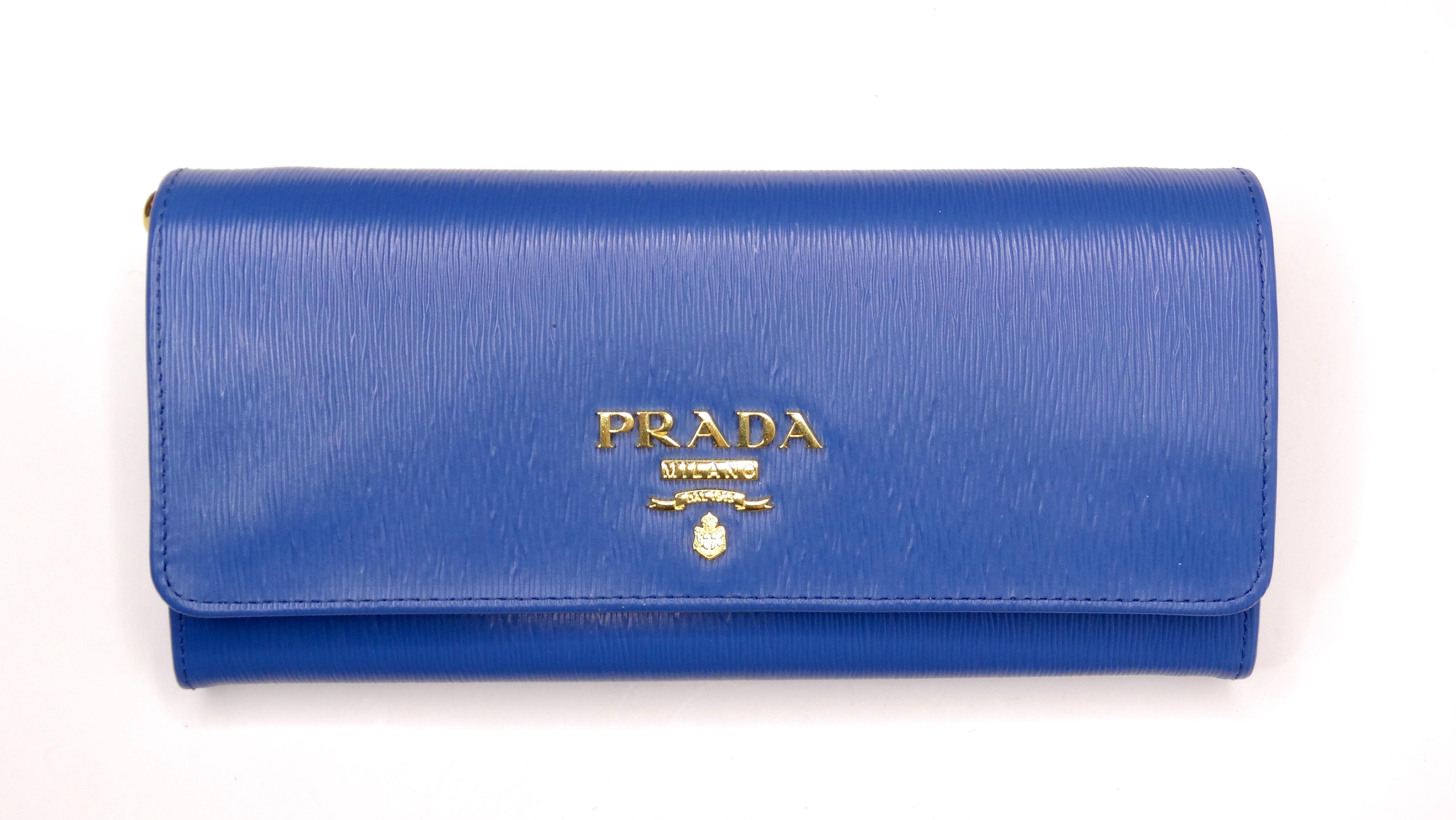 Snag this Prada wallet on a chain today in the most beautiful color! This color is bound to make you happy when wearing it! These style of bags are ultra-versatile as it can be taken through your day of errands or dressed up for a night-look. Use it