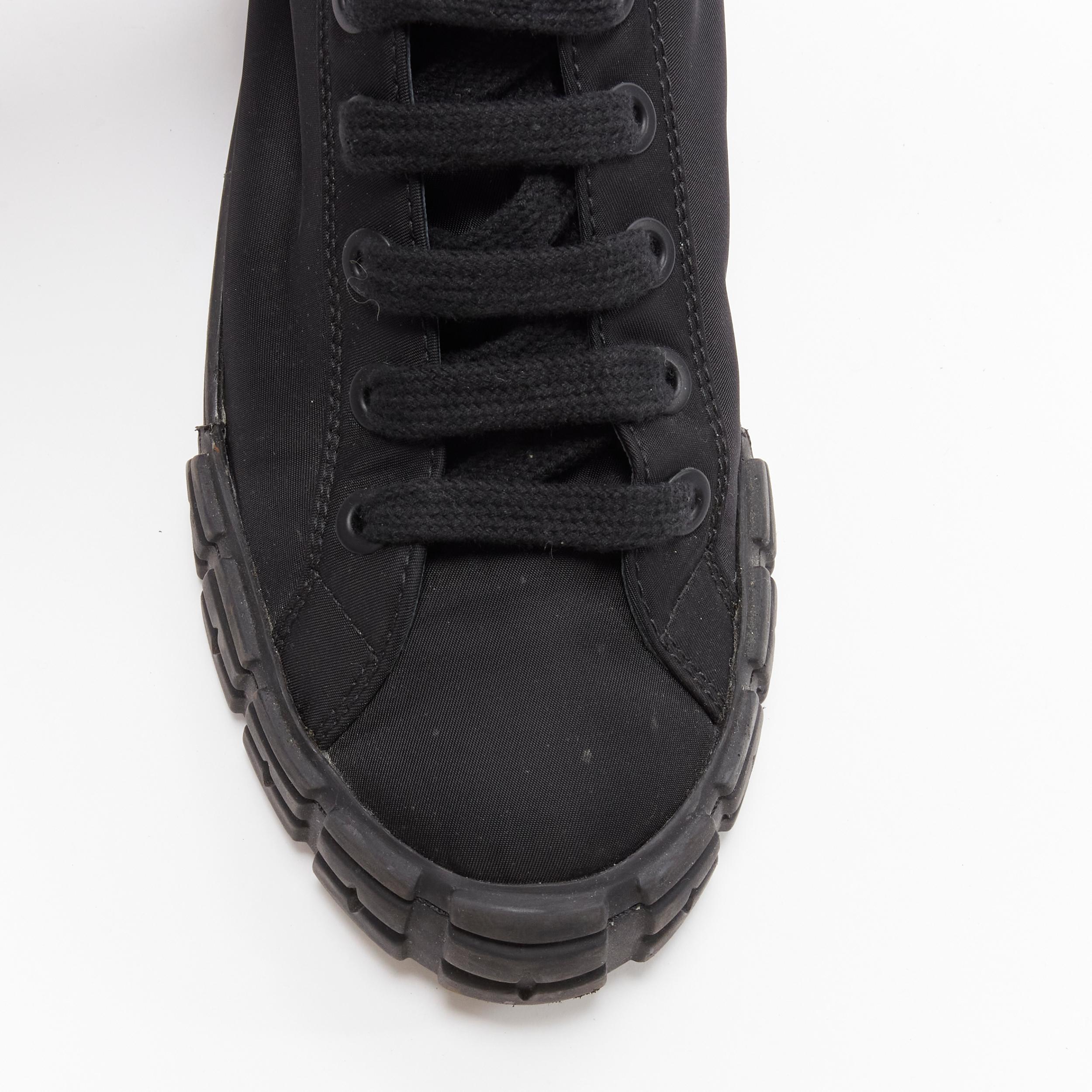 PRADA Wheel black Tessuto nylon silver buckle strap high top sneaker EU37.5
Brand: Prada
Designer: Miuccia Prada
Model: Wheel
Material: Nylon
Color: Black
Pattern: Solid
Extra Detail: Detachable nylon metal buckle strap. Prada logo at