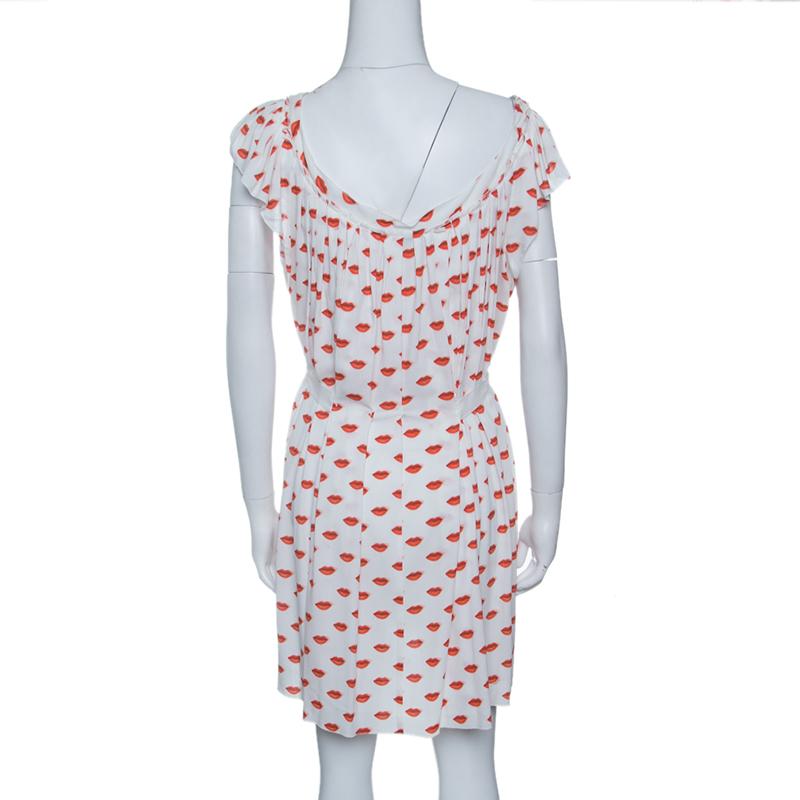 Opt for this Prada dress if you are looking for something groovy yet graceful. This pleated dress is styled with red lip print that looks just wow on the white base. Complete with self-tie at the waist, we like the dress paired with espadrille wedge