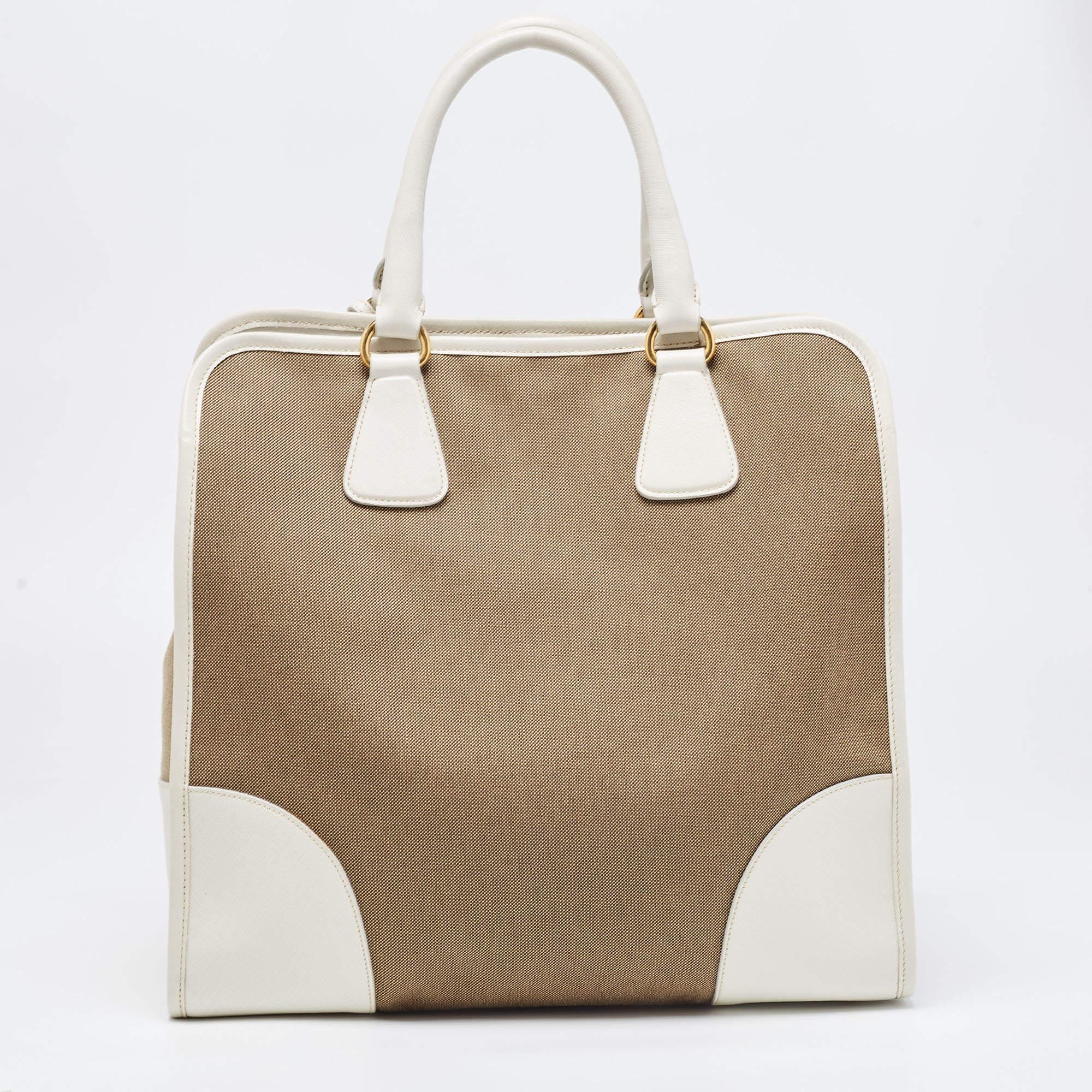 The simple silhouette and the use of durable materials for the exterior bring out the appeal of this designer tote for women. It features comfortable handles and a well-lined interior.

Includes: Original Dustbag, Detachable Strap

