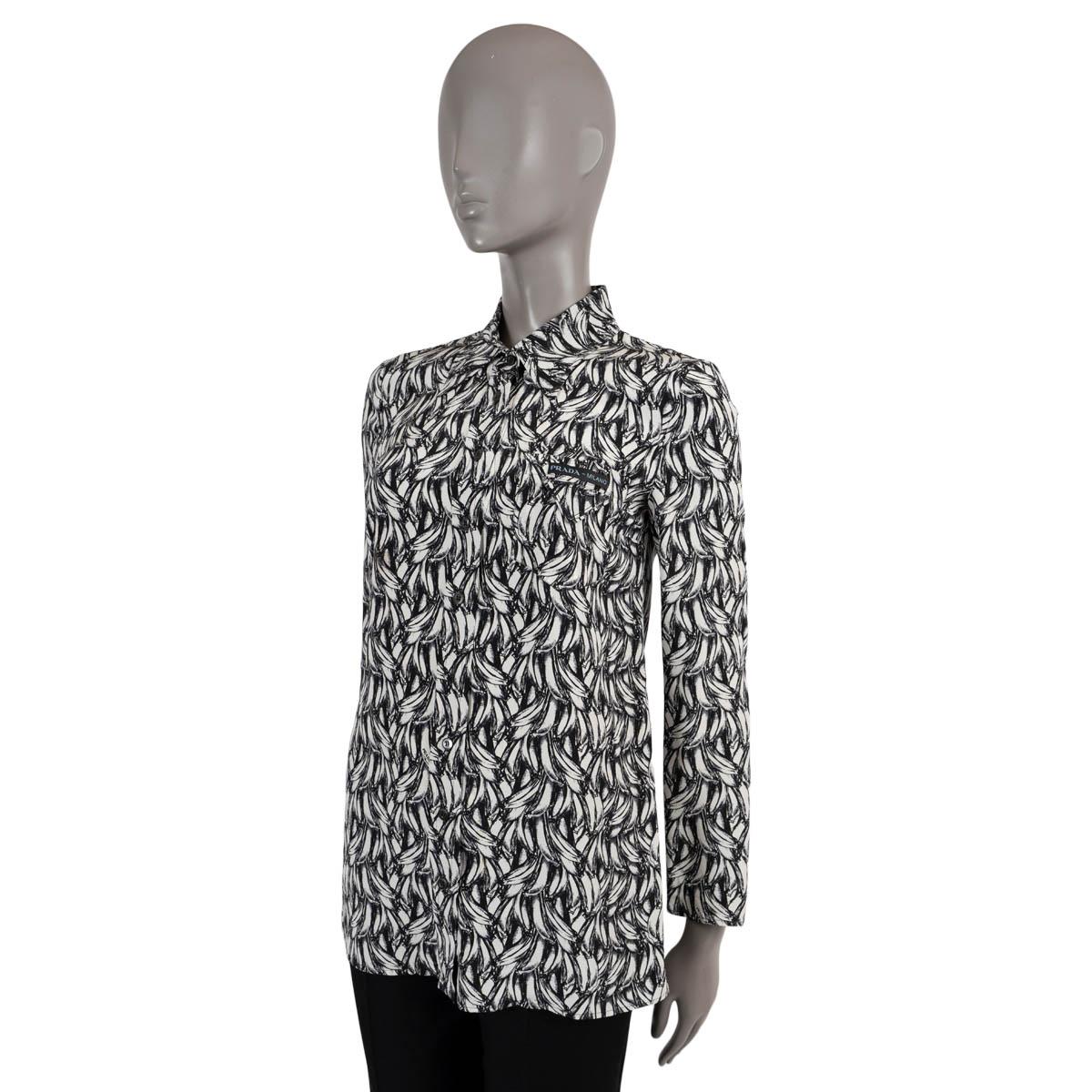 100% authentic Prada blouse in black and white silk (100%). Features a banana print and a chest pocket. Closes with concealed buttons on the front. Has been worn and is in excellent condition. 

2018 Fall/Winter

Measurements
Tag