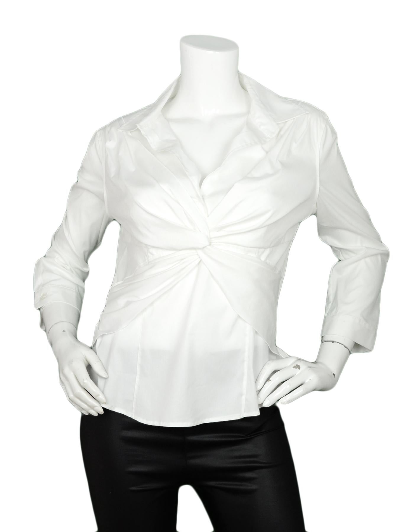 Prada White Cotton Blend Criss-Cross Front Blouse sz IT 46

Made In: Italy
Color: White
Materials: 72% Cotton, 23% Nylon, 5% Elastane
Lining: 72% Cotton, 23% Nylon, 5% Elastane
Opening/Closure: Front buttons
Overall Condition: Excellent pre-owned