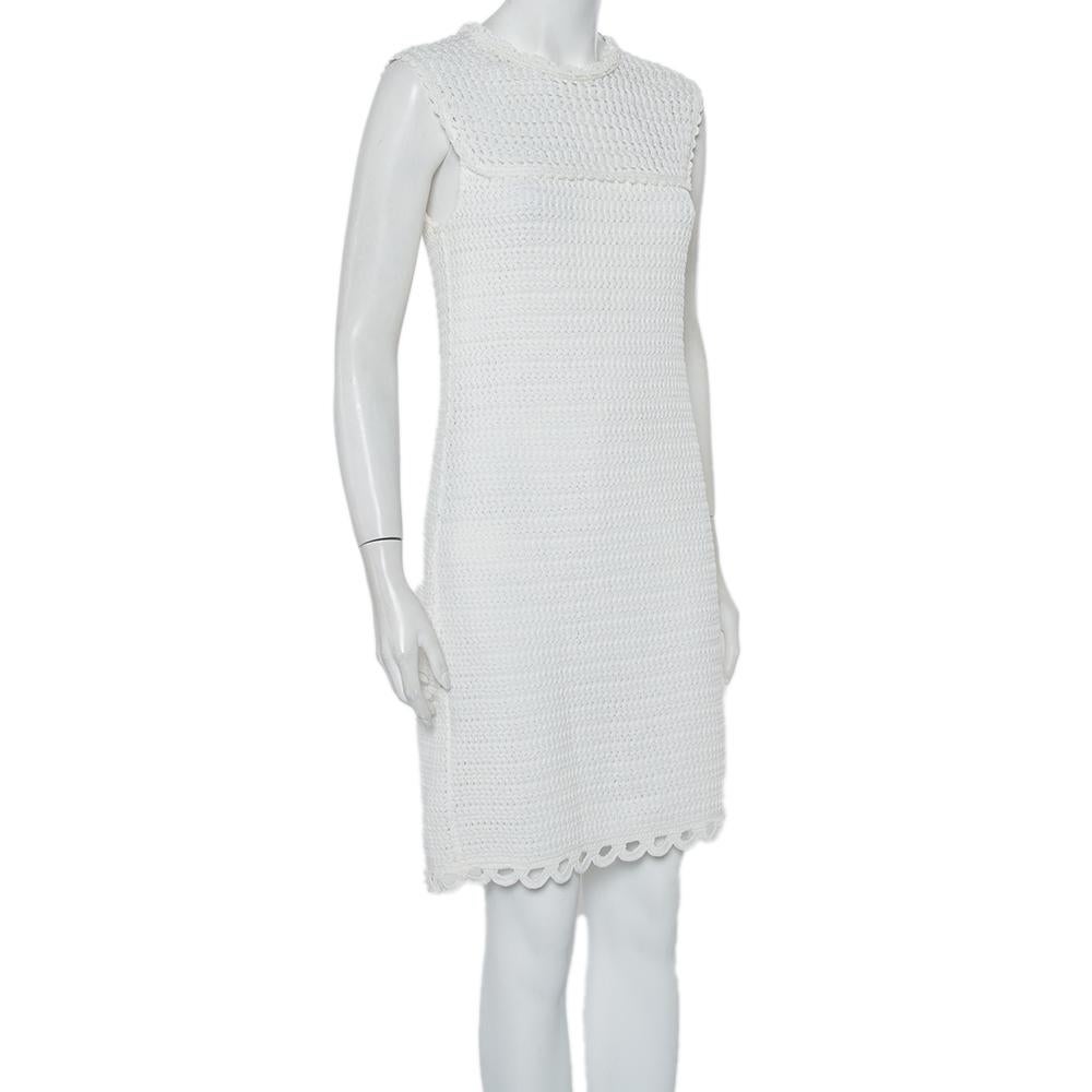 If you're looking for a unique dress, you cannot go wrong with this Prada creation. Opt for this dreamy white crochet dress when you go out for a casual dinner. This sleeveless mini dress is complete with a buttoned fastening.

