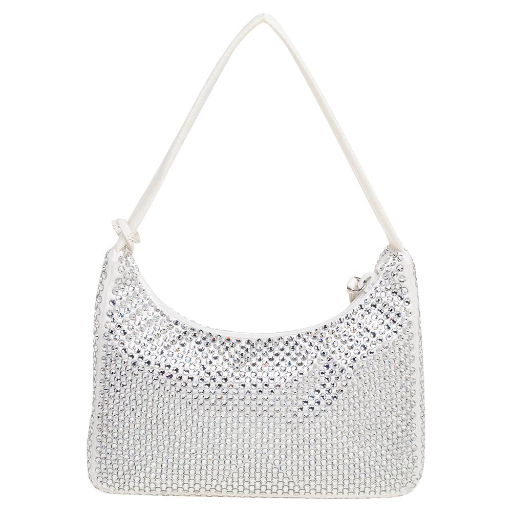 The bag that has caught the instant fancy of celebrities, bloggers, and every one fashionable, Re-Edition 2000 from Prada is one of the IT bags of the season. Designed in a petite silhouette from nylon, the bag impresses in a white hue,