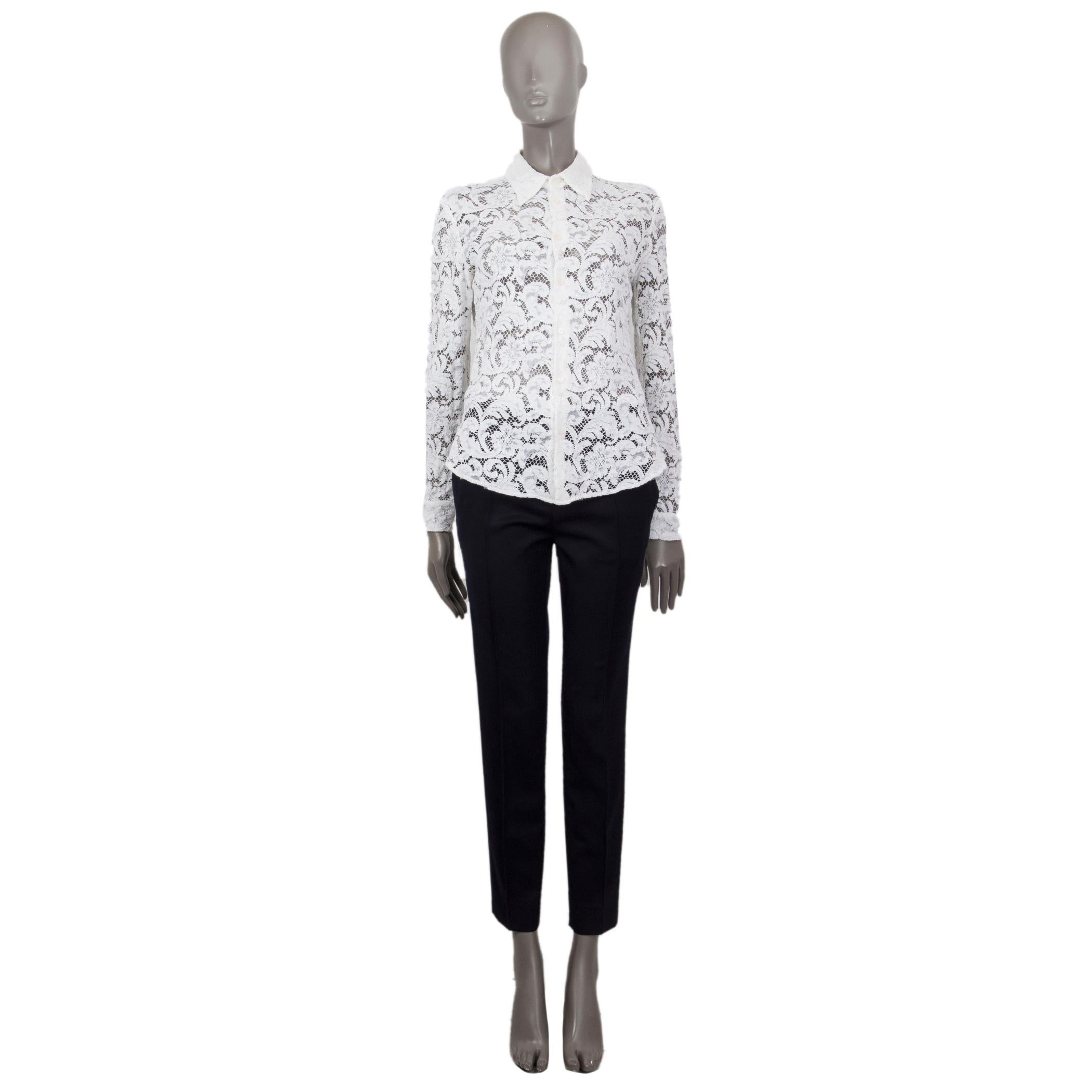 100% authentic Prada long-sleeve semi-sheer lace shirt in white viscose blend (assumed as tag is missing) with a point collar. Closes on the front with buttons and fastens at the cuffs with a button. Unlined. Has been worn and is in excellent
