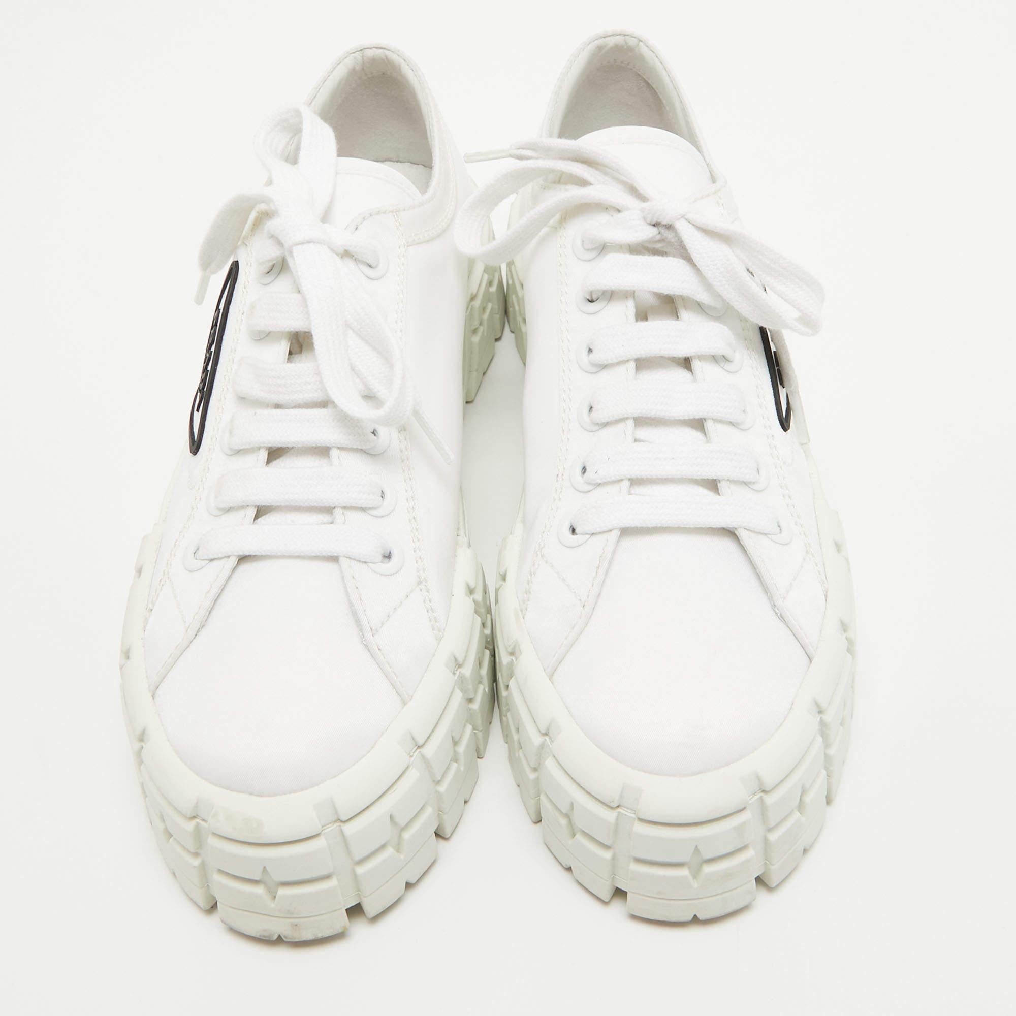 Step into fashion-forward luxury with these Prada white sneakers. These premium kicks offer a harmonious blend of style and comfort, perfect for those who demand sophistication in every step.

Includes
Original Dustbag, Original Box, Info Booklet,
