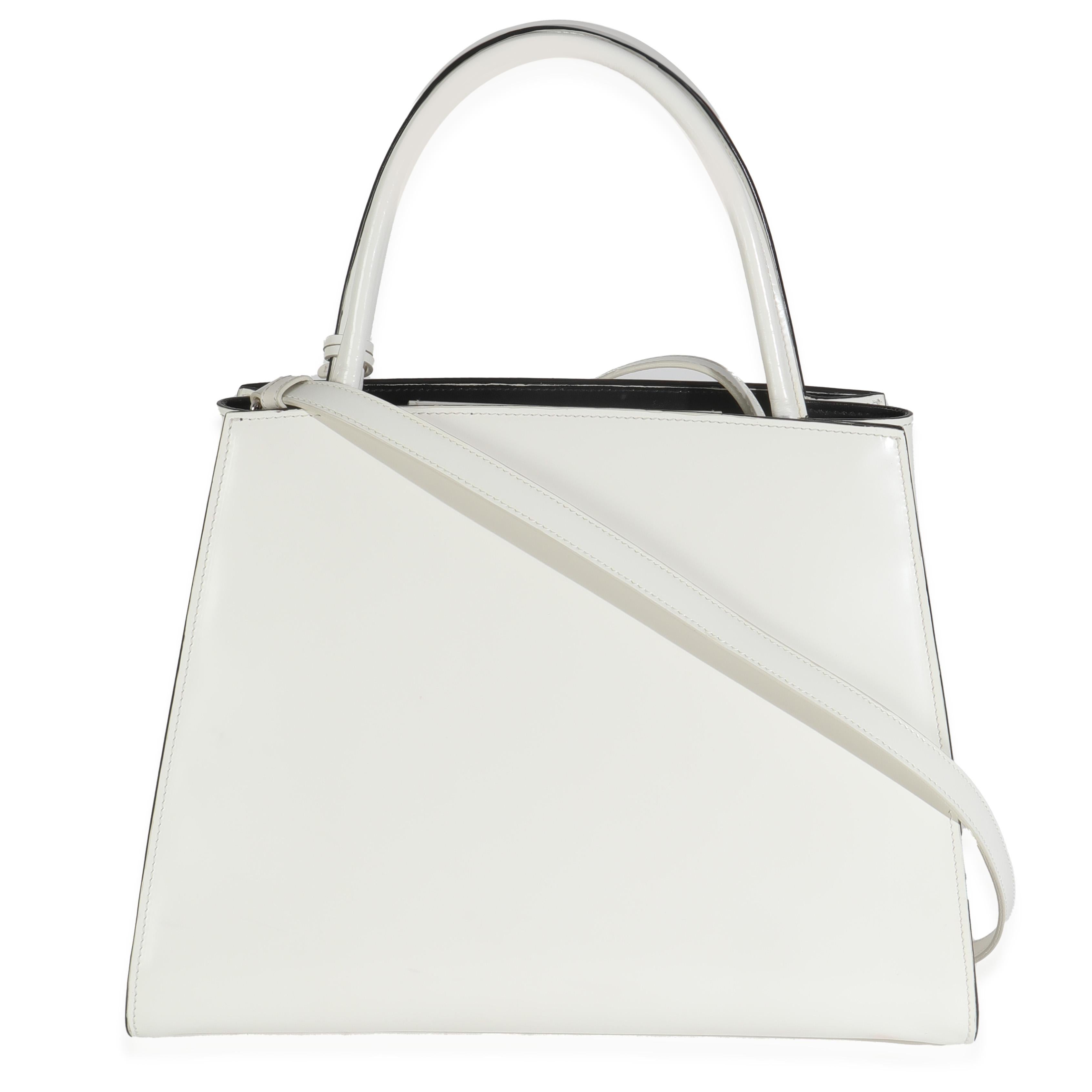 Listing Title: Prada White Spazzolato Trapeze Logo Plaque Tote
SKU: 144936
Condition: Pre-owned 
Handbag Condition: Very Good
Condition Comments: Item is in very good condition with minor signs of wear.  Faint glue transfer along side. Marks, wear,