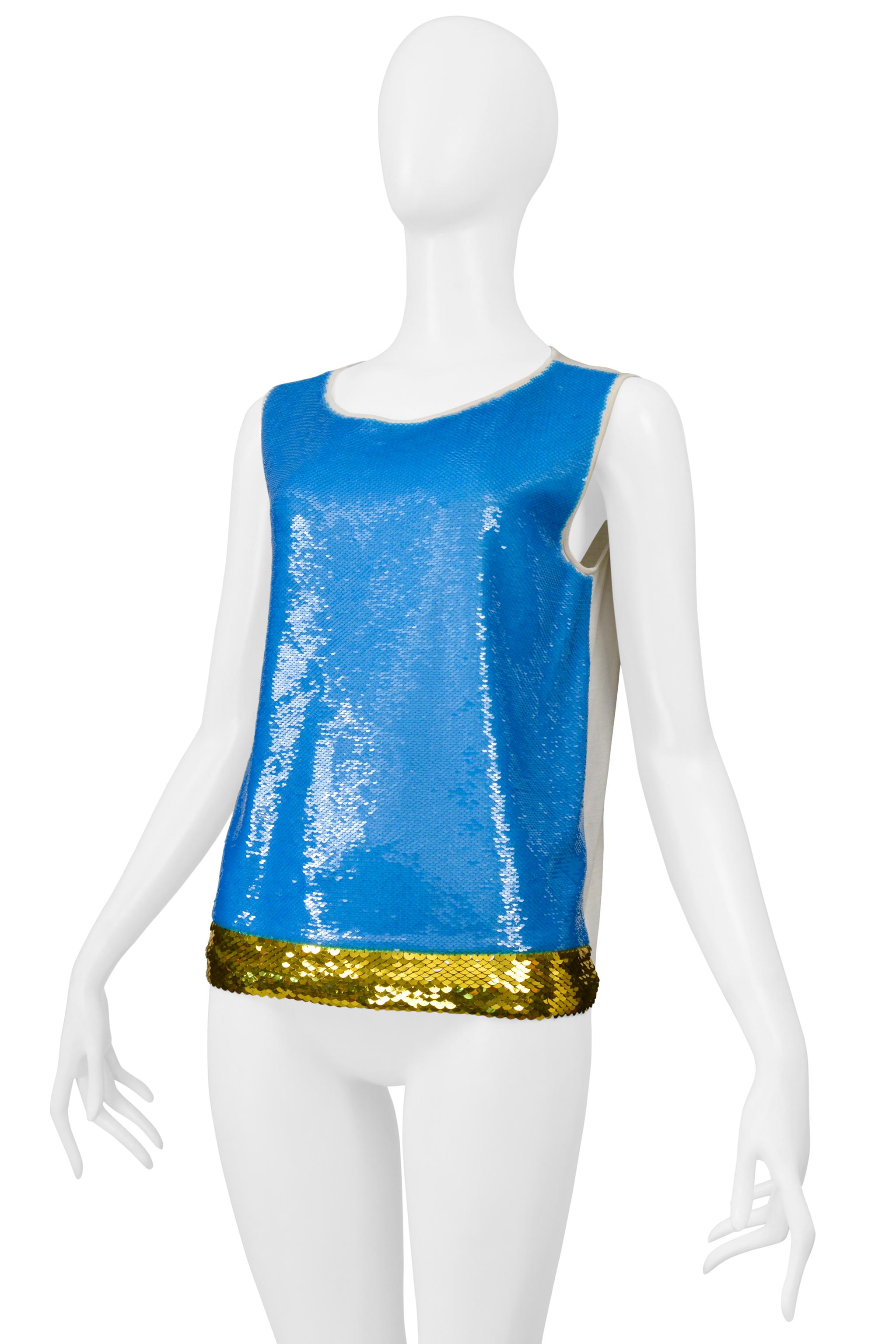 

Resurrection Vintage is thrilled to present a Prada white t-shirt adorned with blue sequins on the front panel, gold sequin trim, a tank-style body, and a t-shirt back. 

Prada

Size: I42
No Fabric Label Feels Like Cotton And Sequins
Very Good