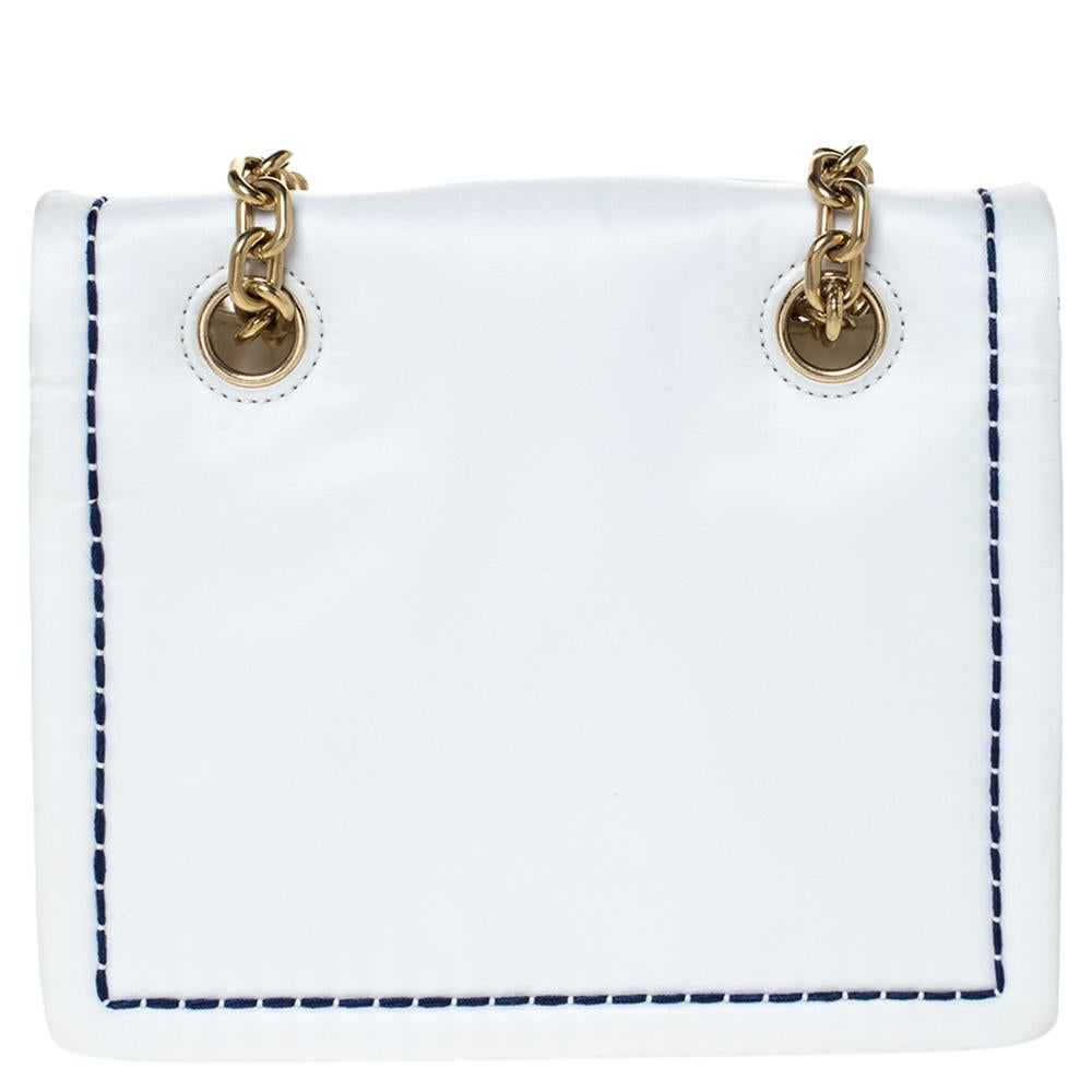 This lovely bag by Prada carries an elegant and chic design. It will be a head-turning addition to anything you wear it with. It features a front flap decorated with a logo plaque, a nylon exterior and a shoulder strap. Grab this striking piece