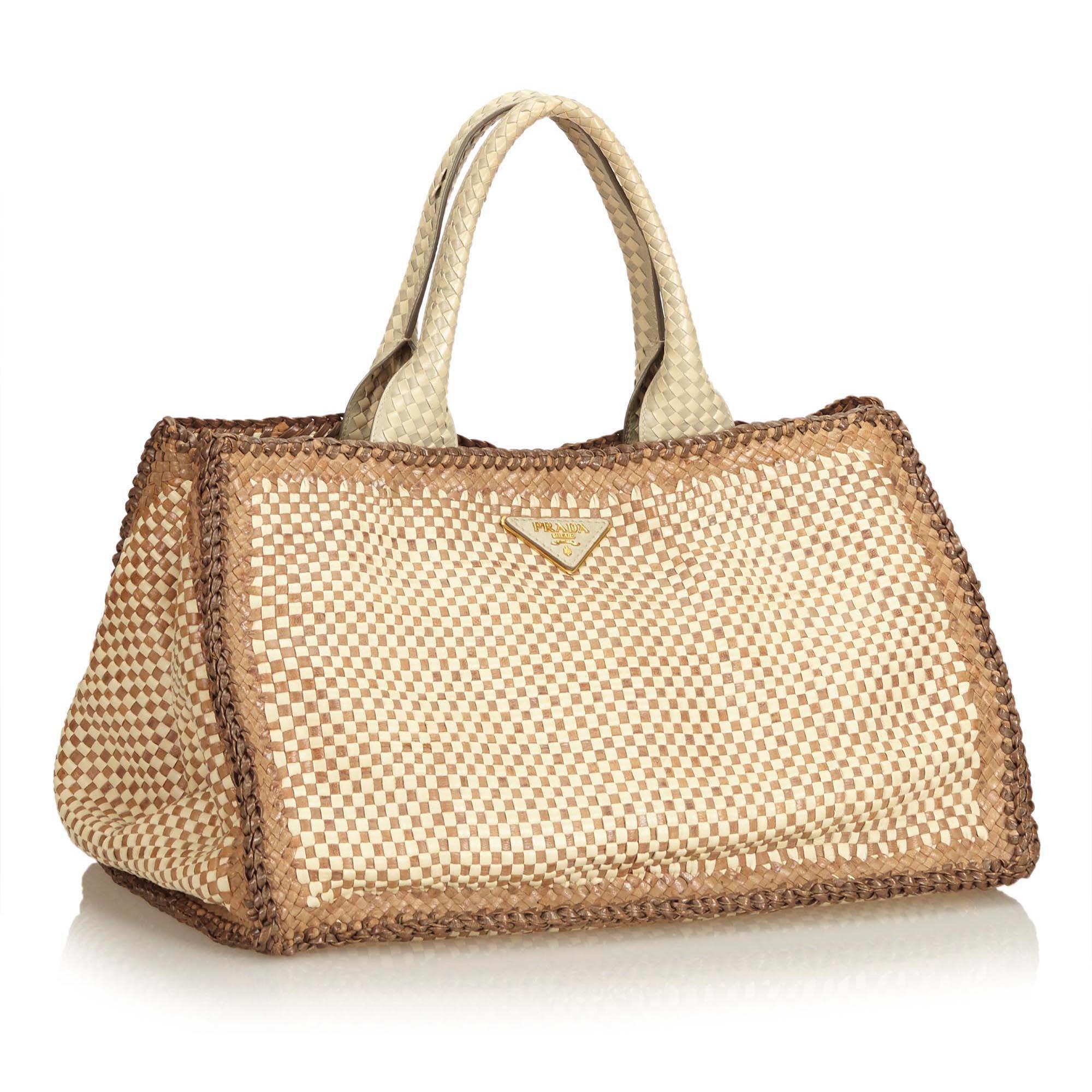 The Madras Tote features a woven leather body, braided leather handles, open top with magnetic snap closure, and interior zip and slip pockets. It carries as B+ condition rating.

Inclusions: 
Dust Bag

Dimensions:
Length: 26.00 cm
Width: 39.00
