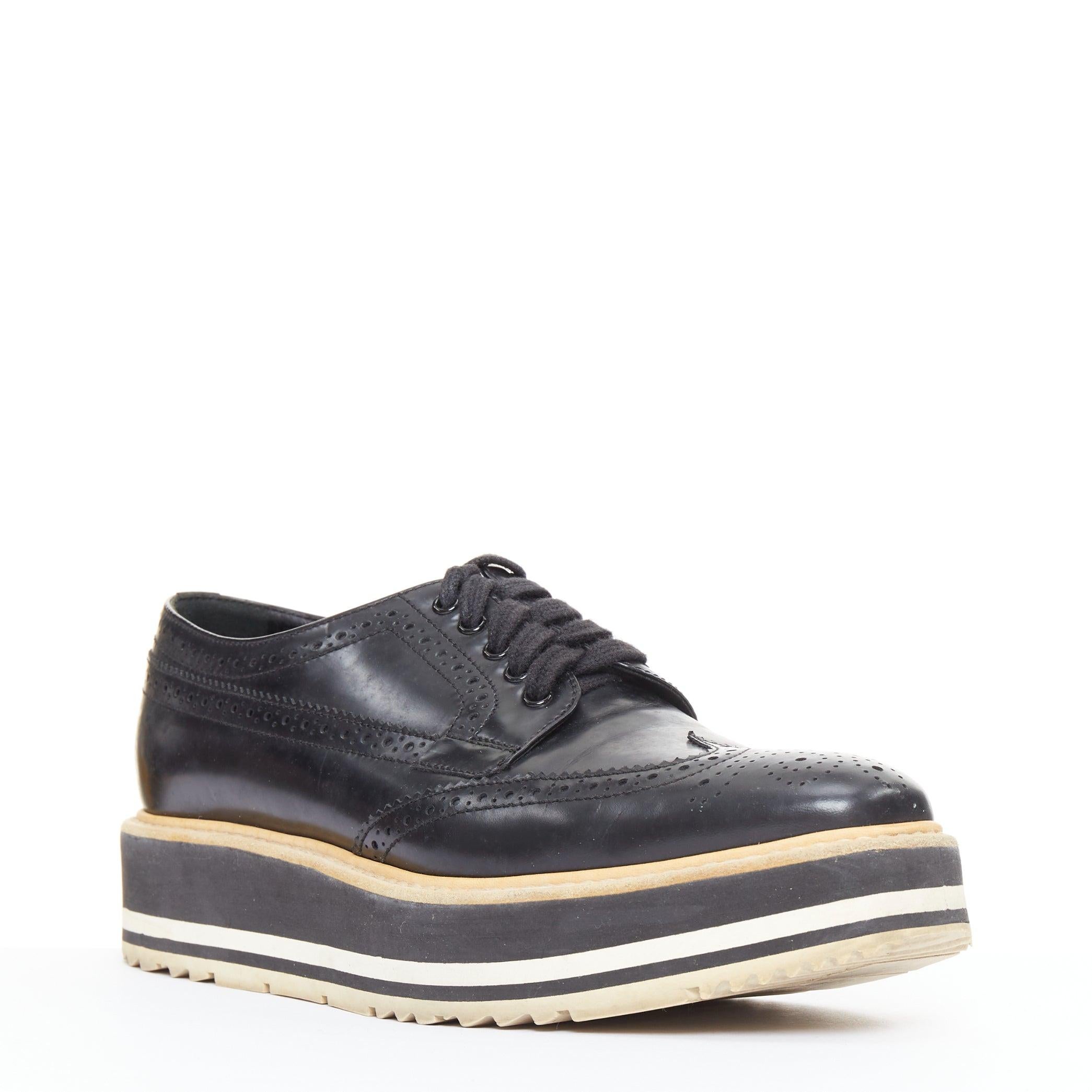 PRADA Wingtip black white beige platform brogue oxfords EU37.5
Reference: GEGG/A00223
Brand: Prada
Designer: Miuccia Prada
Collection: 2011
Material: Leather
Color: Black, White
Pattern: Solid
Closure: Lace Up
Lining: Black Leather
Made in: