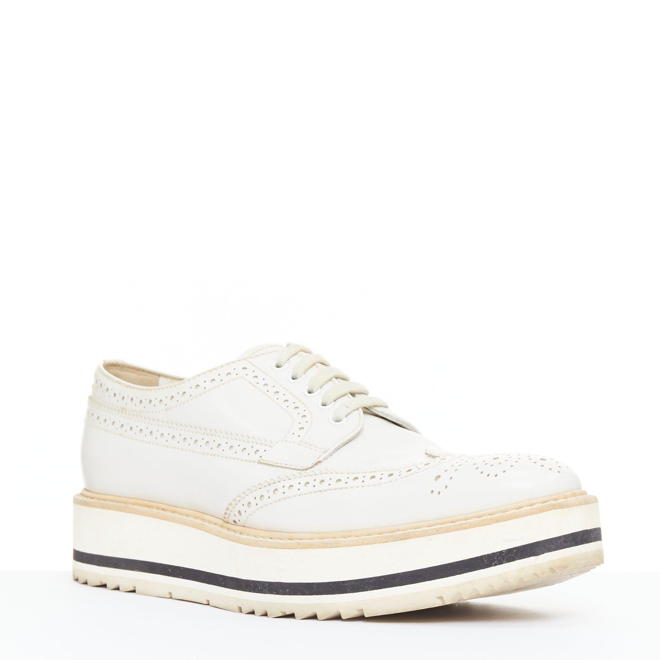 PRADA Wingtip white leather black beige platform brogue oxfords EU38
Reference: GEGG/A00219
Brand: Prada
Designer: Miuccia Prada
Collection: 2011
Material: Leather
Color: White, Black
Pattern: Solid
Closure: Lace Up
Lining: White Leather
Made in: