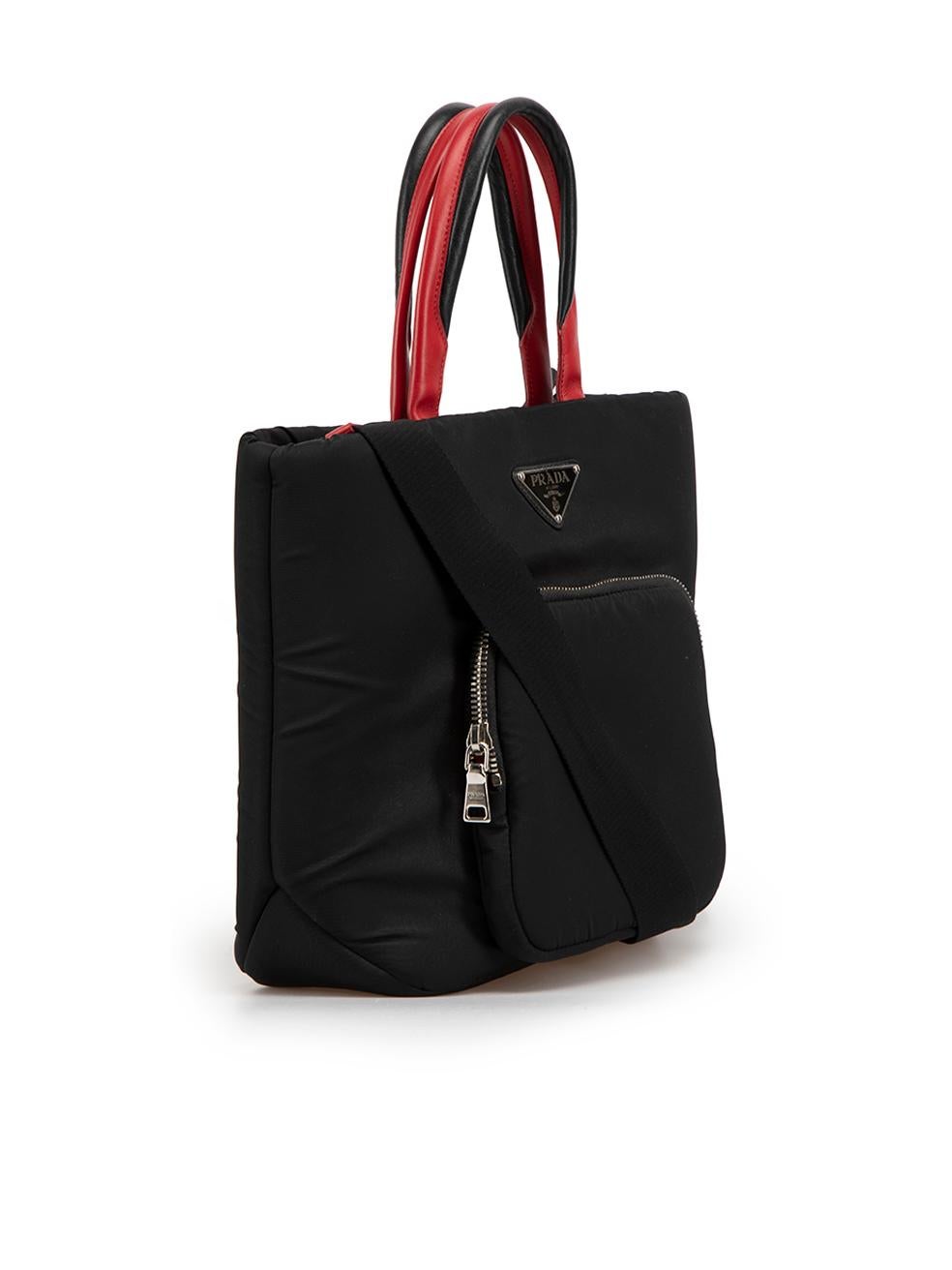 CONDITION is Very Good. Minimal wear to bag is evident. Minimal wear to the lining, front and back with discoloured markings on this used Prada designer resale item.



Details


Black

Nylon

Handbag

Silver tone hardware

2x Black and red leather