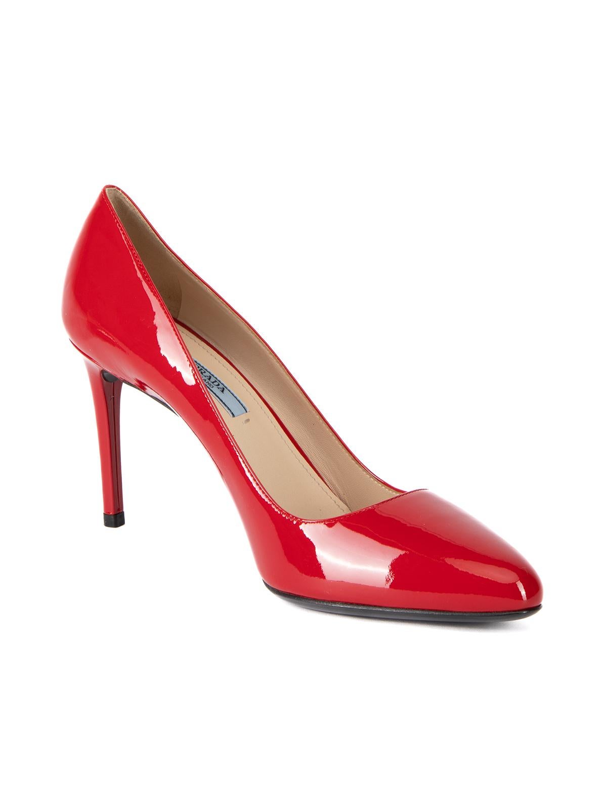 CONDITION is Very good. No visible wear to heels is evident on this used Prada designer resale item.   Details  Red Patent leather Pumps High heel Almond toe Comes with dust bag and original box    Made in Italy    Composition Patent leather   Size