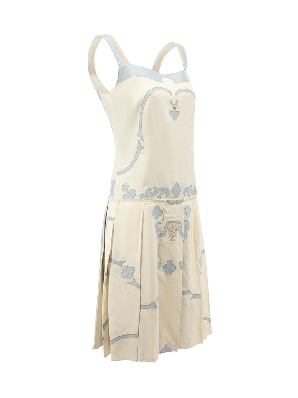 CONDITION is Very good. Hardly any visible wear to dress is evident. Minor loose threads along hem is seen on this used Prada designer resale item.   Details  Cream Linen Mini dress Blue appliqué design Pleated skirt Frill finishing Side zip closure