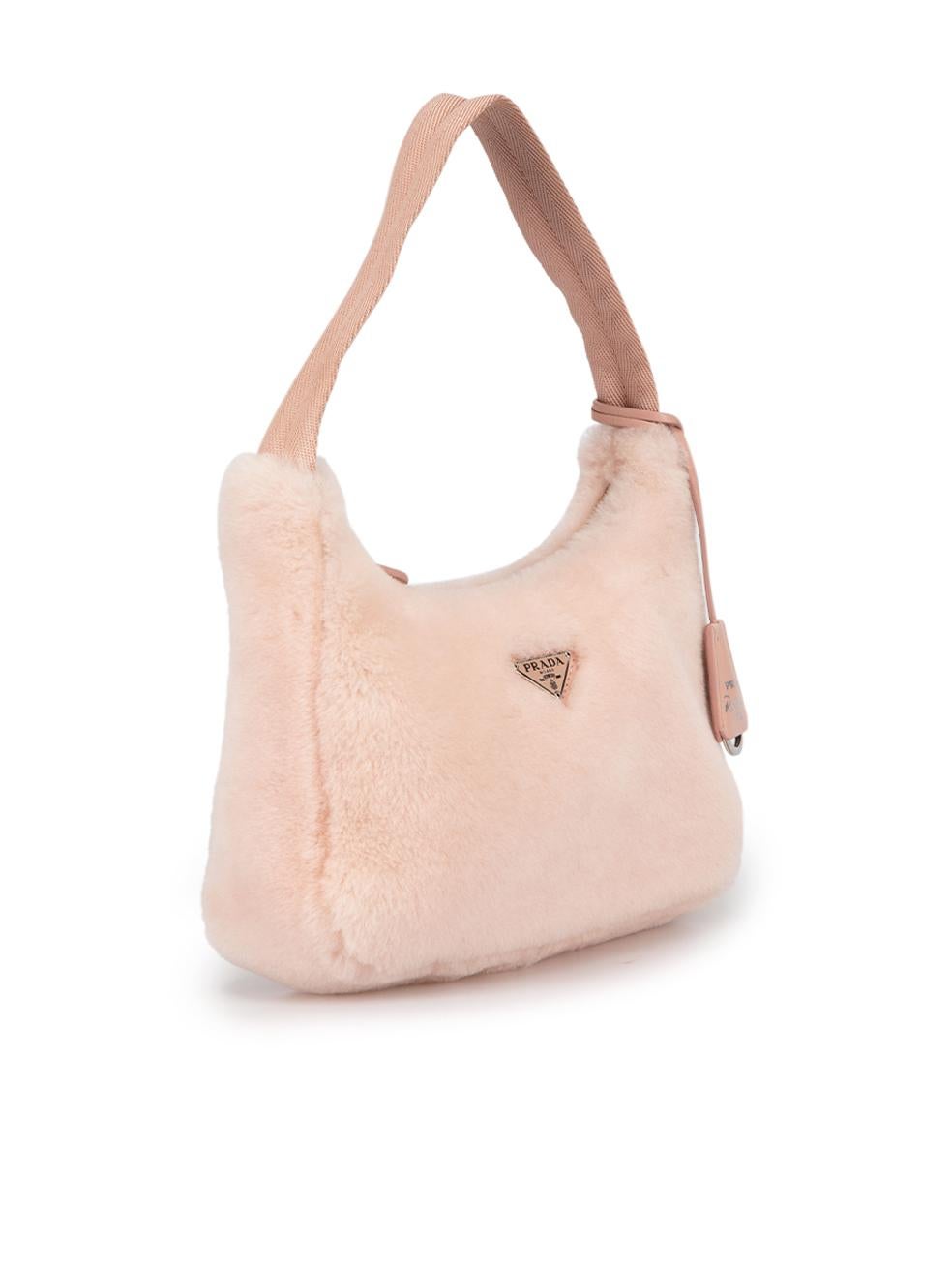 CONDITION is Very good. Minimal wear to bag is evident. Minimal wear to the top handle with slight discolouration at the edge on this used Prada designer resale item. This bag comes with dust bag.



Details


Pink

Sheep shearling

Mini shoulder