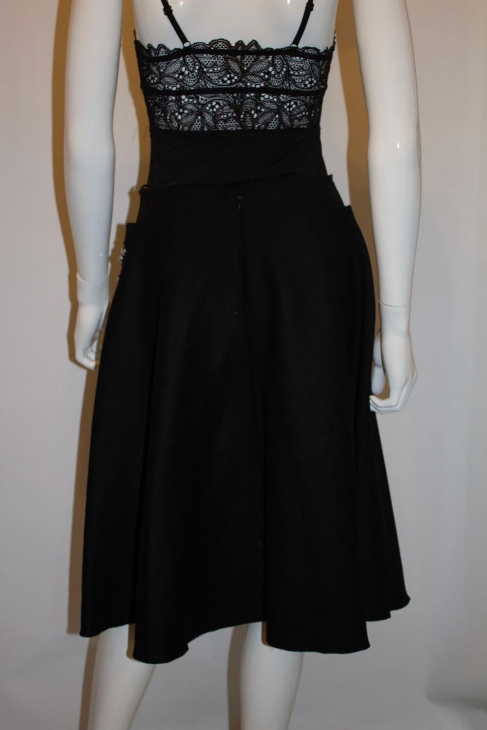 A stunning skirt by Prada. The skirt is in black wool with two pockets  , a back central zip and is not lined. The embellishments on the front are stunning.
Size 42  measurements waist 27    length 25

