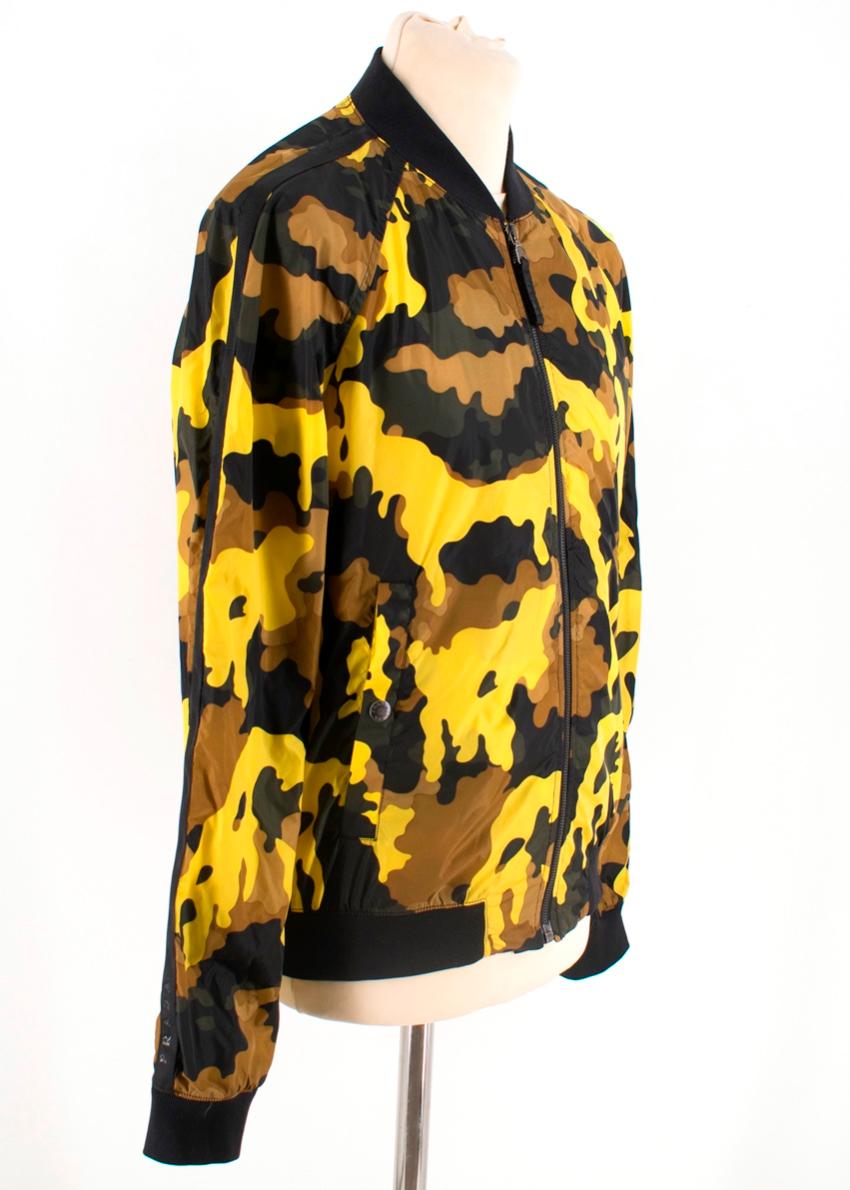 Prada Yellow Nylon lightweight bomber jacket with Camouflage pattern. 

- Front zipper
- Two front pockets 
- Outer: 100% Nylon
- Exterior: 100% Polyamide 
- Made in Italy 


Please note, these items are pre-owned and may show signs of being stored