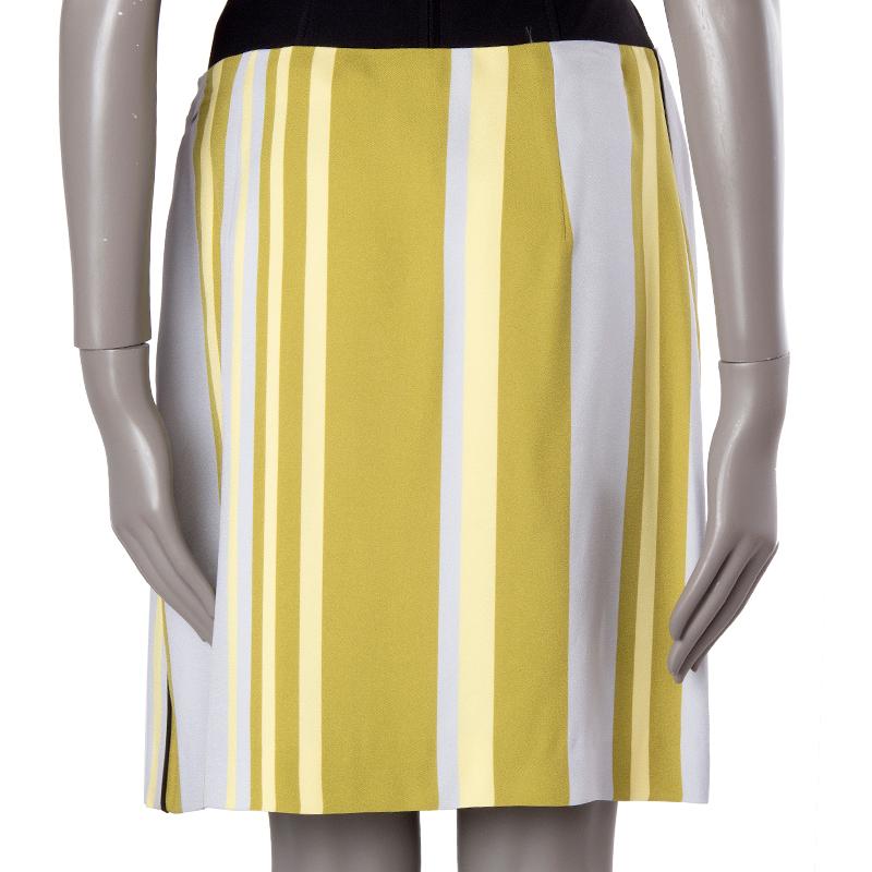 Prada striped A-line skirt in lavender, yellow, olive, and black viscose (100%). Closes with invisible side zipper. Lined in off-white viscose (87%) and silk (23%). Has been worn and is in excellent condition.

Tag Size 44
Size L
Waist 78cm