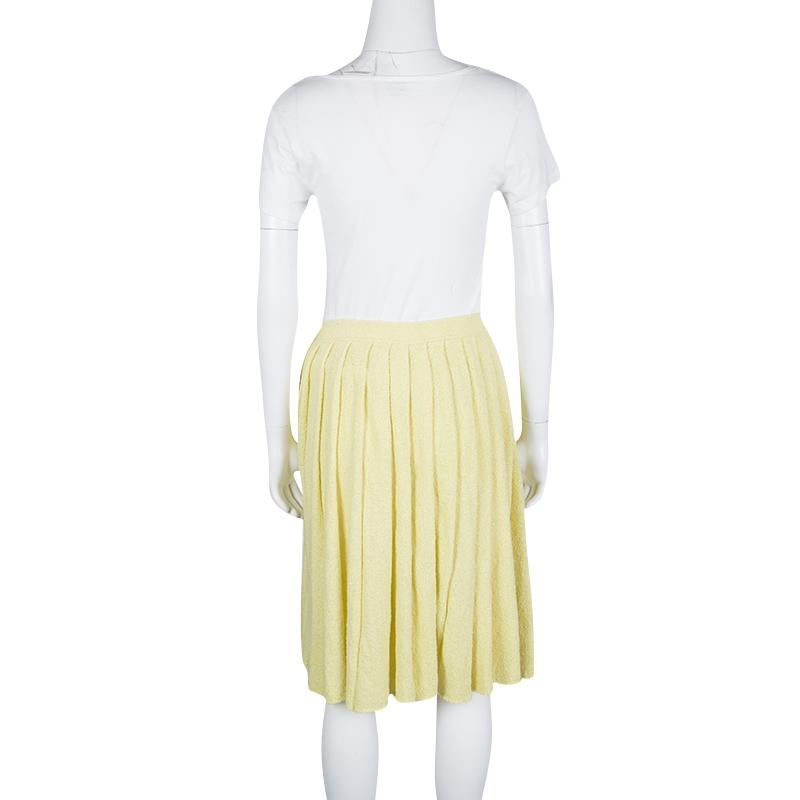 Prada's yellow skirt ensures a flattering silhouette with its comfortable length and beautifully pleated design. It is a perfect piece for casual day outs, so pair it with a fitted top and sneakers to look stylish.

Includes: The Luxury Closet