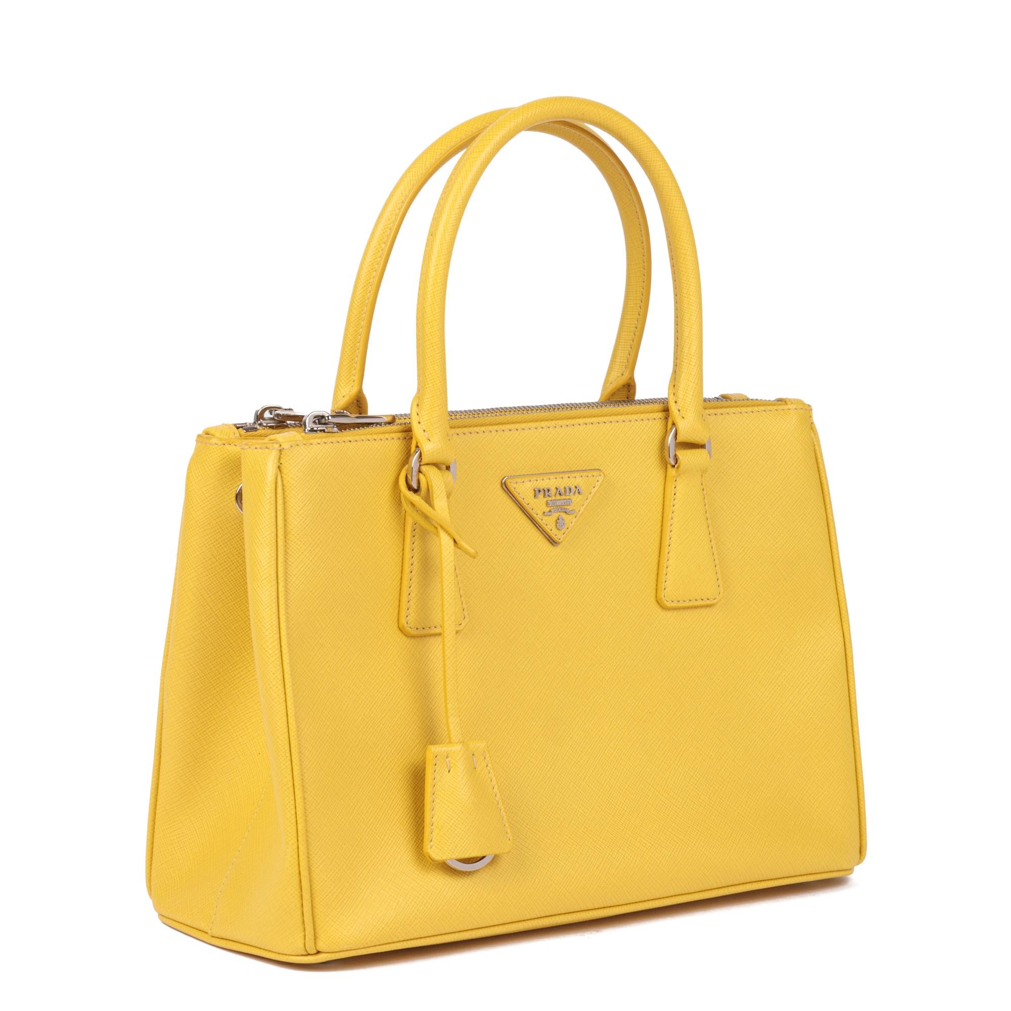 PRADA
Yellow Saffiano Leather Galleria Tote

Xupes Reference: CB844
Serial Number: 7/A
Age (Circa): 2015
Accompanied By: Authenticity Card, Care Card, Shoulder Strap, Dust bag for Strap, Clochette
Authenticity Details: Date Stamp (Made in