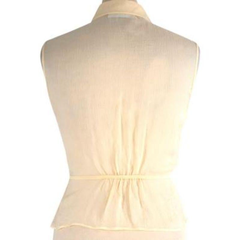 Prada Primrose Yellow Silk Crepe Drawstring Sleeveless Blouse

- Light weight, fluid silk body
- Sheer 
- Draw string hip fastening
- Shirt collar 
- Sleeveless 
- Front button stand fastening 

Materials:
100% Silk 

Made in Italy 

Dry clean only