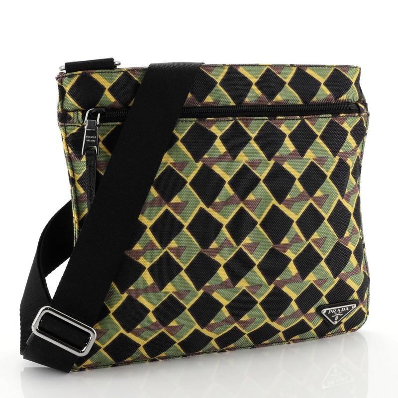 This Prada Zip Messenger Bag Printed Tessuto Medium, crafted from green multicolor printed tessuto, features an adjustable shoulder strap, exterior zip pocket, and silver-tone hardware. Its top zip closure opens to a black fabric interior with zip