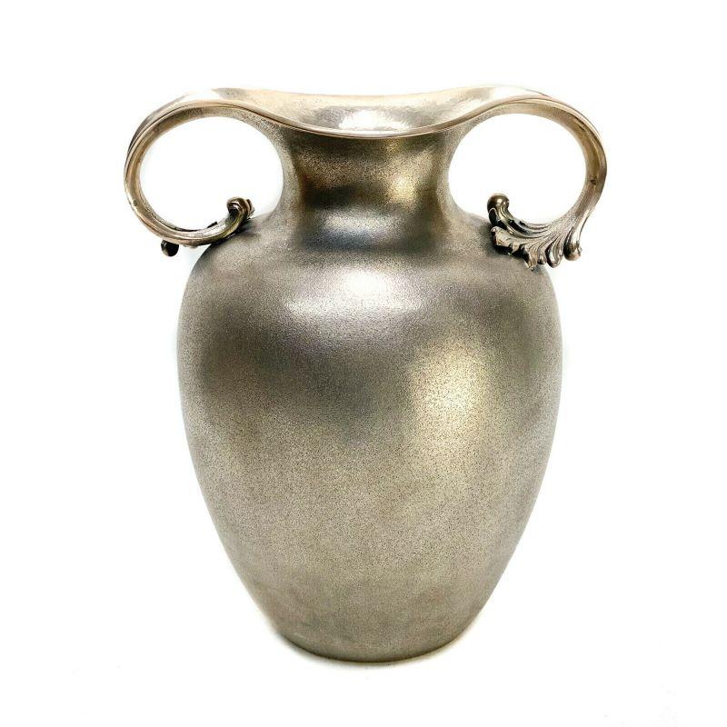 Pradella Ilario sterling silver twin handled vase for Tiffany & Co., circa 1950

Fine texture throughout. Twin handles that terminate to acanthus leaves. Pradella Ilario for Tiffany & Co. sterling silver marks to the underside base.

Additional