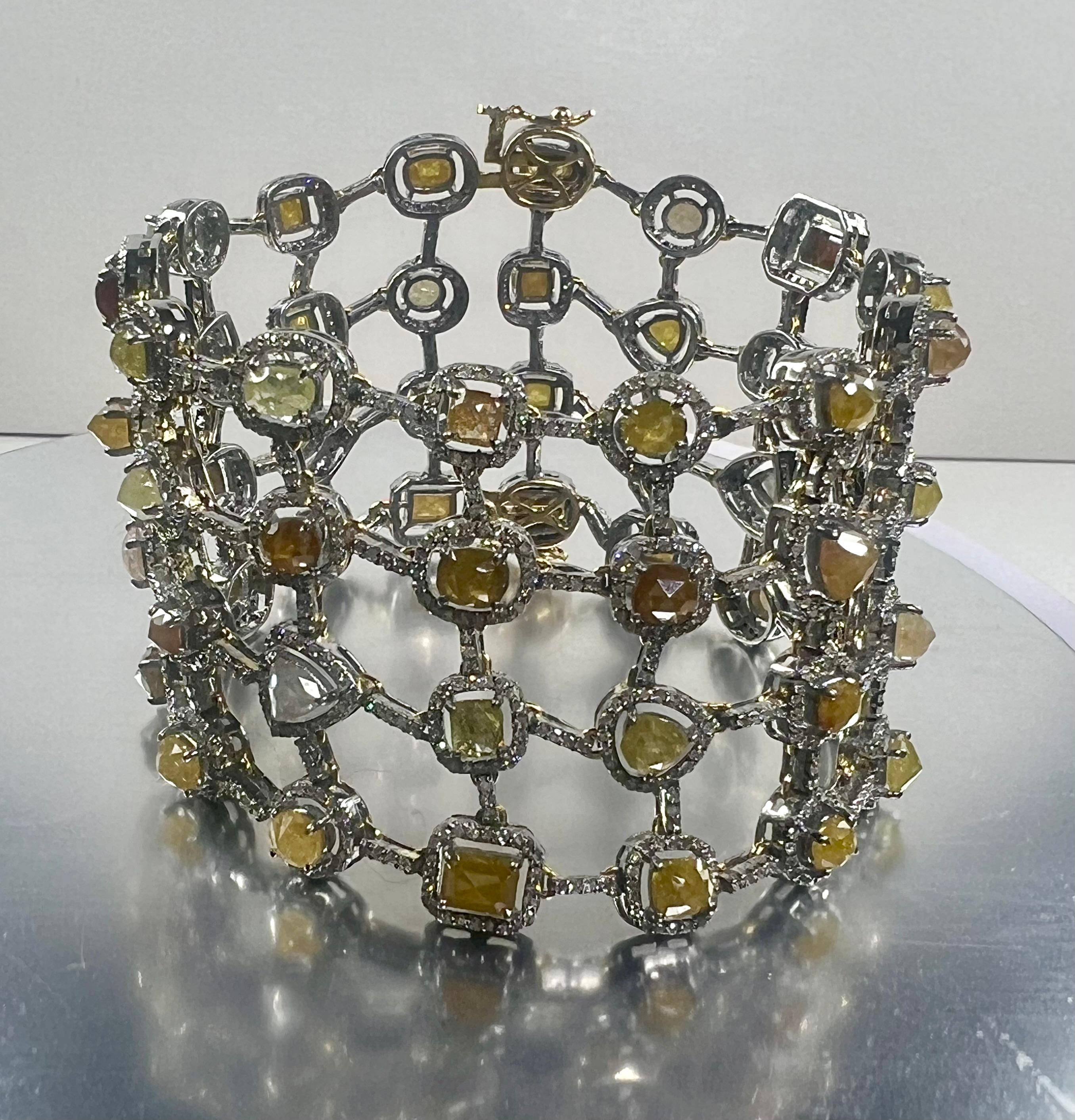 Pradera D'Art 14k yellow gold diamonds and fancy yellow diamonds Cuff Bracelet

◘ Gold Weight 6,55gr.
◘ Silver Weight 39,47 gr.
◘ Diamonds aprox 5,86ct
◘ Fancy Diamonds aprox. 23,50ct
◘ Total Weight 52 gr.
◘ Measure 4.2cm x 17.5cm / 1.65 inc x 6.89