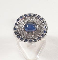Pradera Ring with a Central Sapphire and Little Sapphires and Diamonds