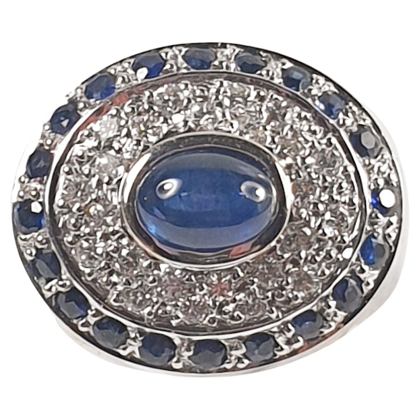 Pradera Ring with a Central Sapphire and Little Sapphires and Diamonds