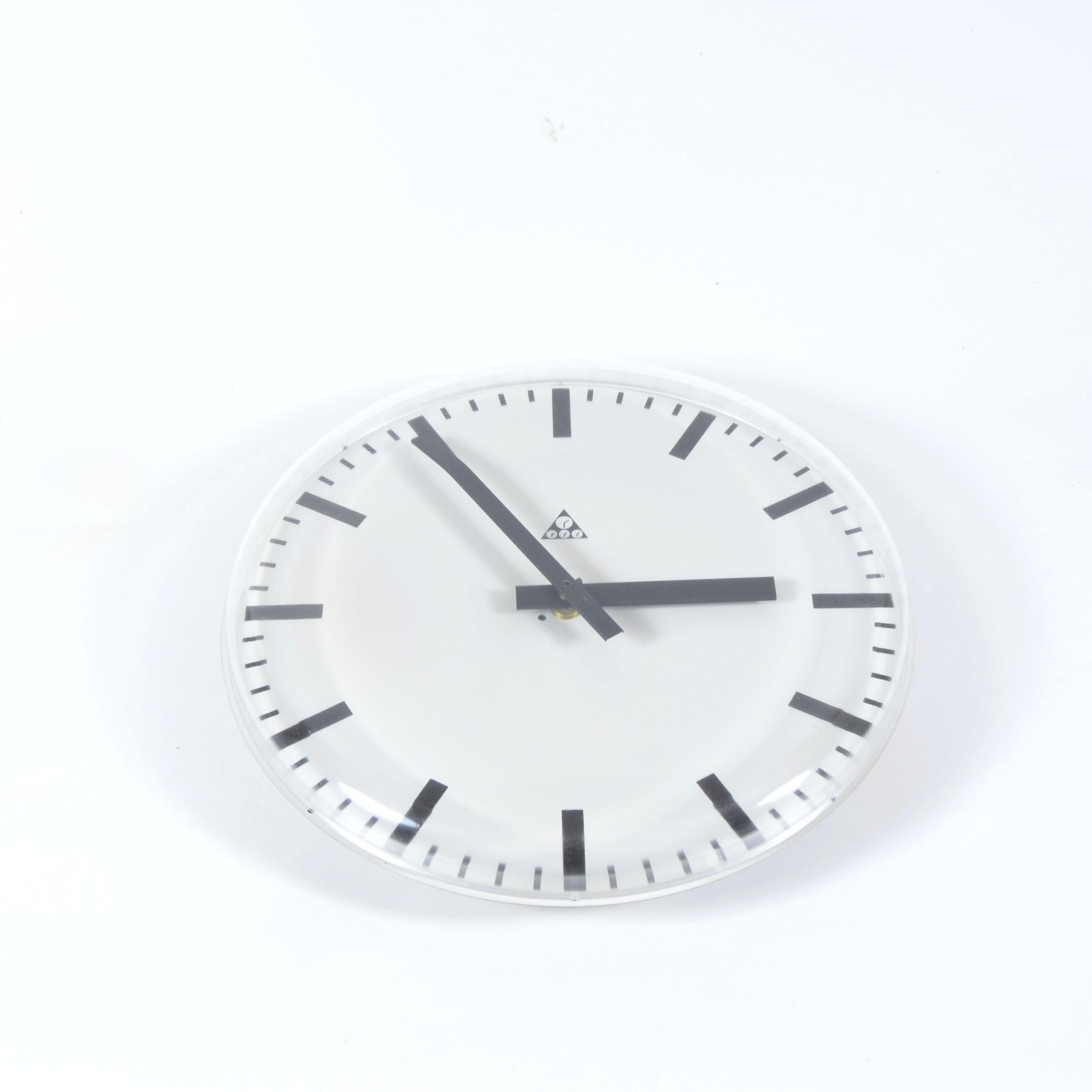 Plastic wall clock manufactured in former Czechoslovakia by famous clock manufacture Pragotron. This clock is special model without any frame. Clock is converted into a battery-powered clockwork working for 1 x AA battery. It operates as an