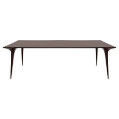 Prague Table Featuring Sleek Design and Unique Leg Detail