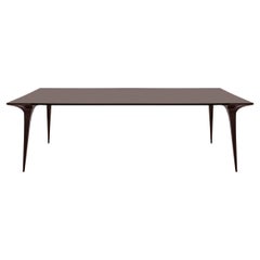 Prague Table Featuring Sleek Design and Unique Leg Detail 