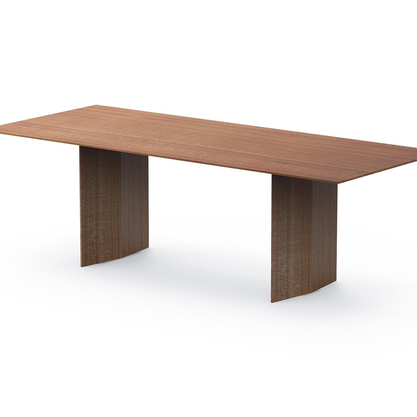 A sophisticated and essential table featuring an extremely simple and linear design. The Praia table is entirely made of veneered multi-layered Canaletto walnut, its height is 75 cm and combines with any type of environment. The rectangular top, in