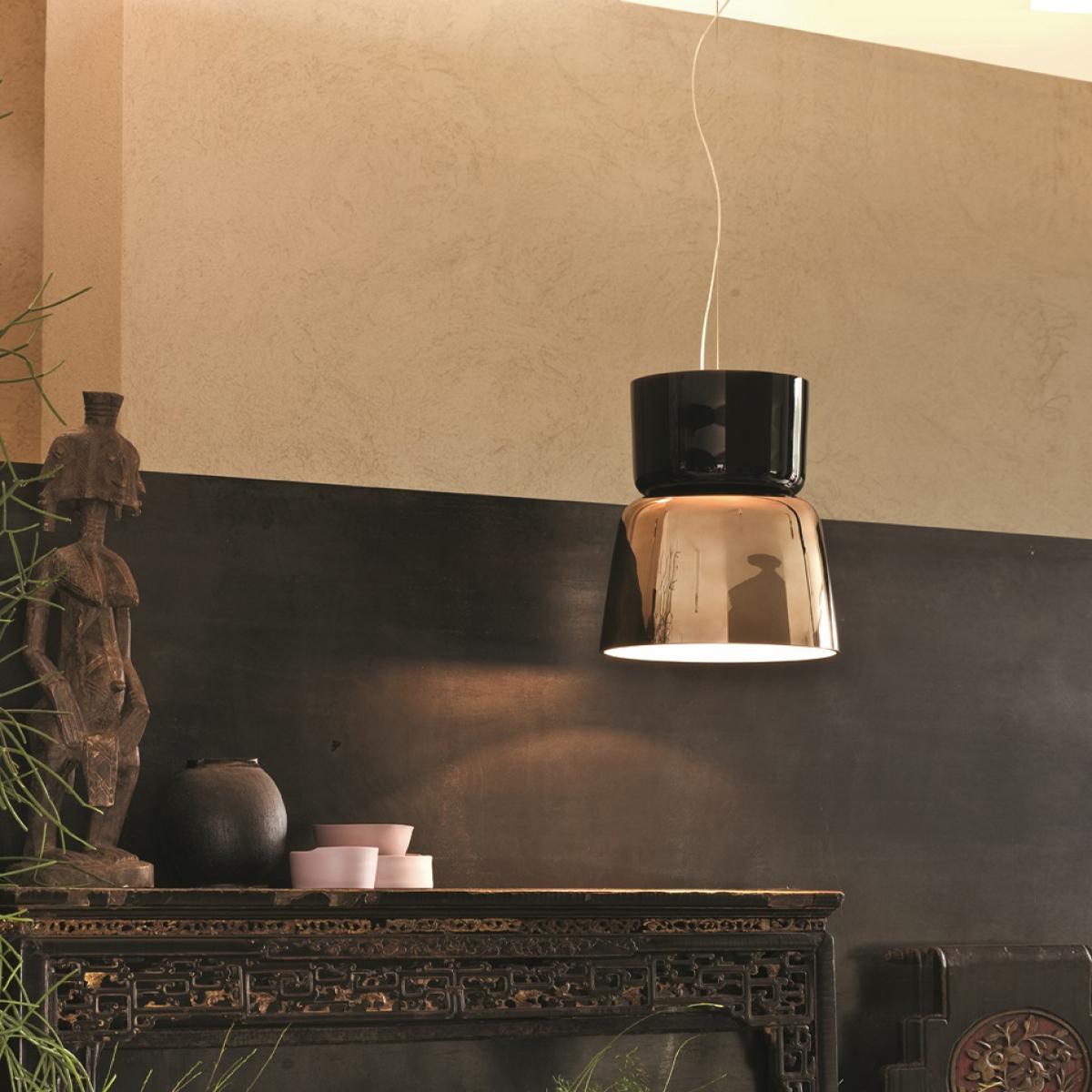 Handblown in Italy by the glass masters at Prandina, the Bloom S5 pendant light features two large glass diffusers arranged in the shape of a blossoming flower. Painted and hand polished, each diffuser is given life by Bloom's incandescent light