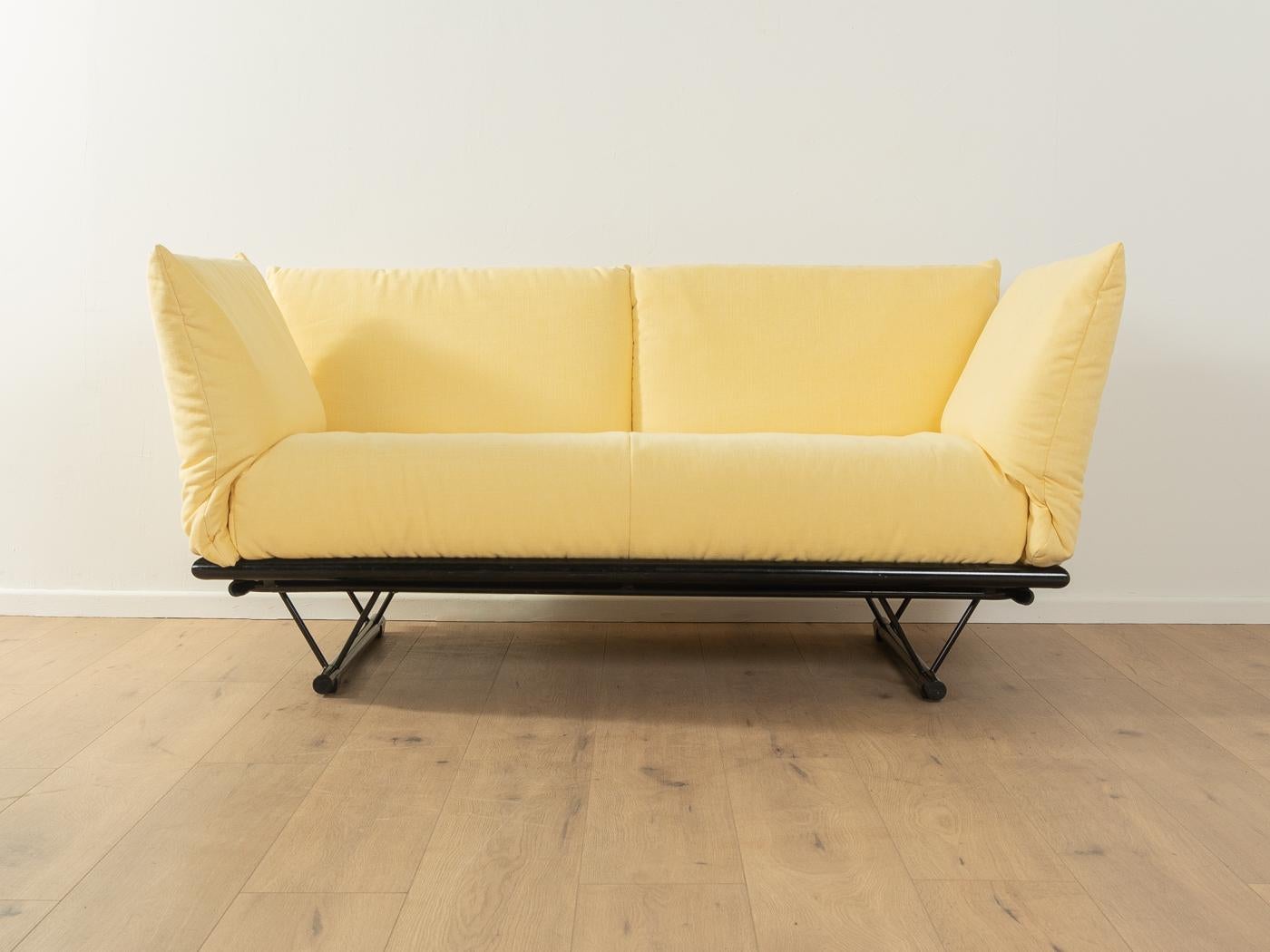 Multifunctional PRAO sofa by Peter Maly for Ligne Roset with new padding and a new high-quality fabric in pastel yellow. The sofa can be transformed into a sofa bed, chaise longue or daybed in just a few steps. The sofa was manufactured from 1985 to