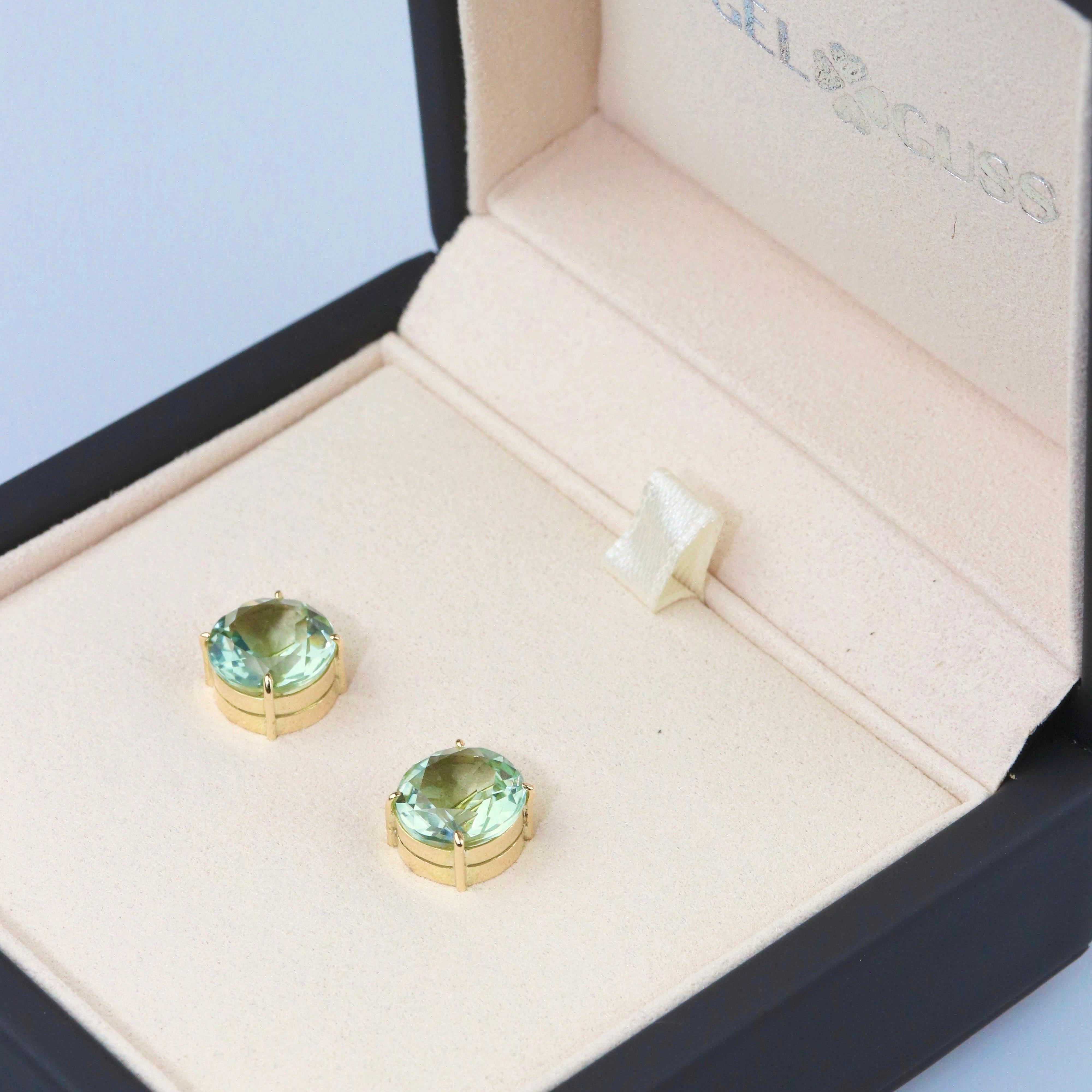18K Solid Yellow Gold 

Natural Prasiolite: 10x10mm, 6.70cts, round shape

Adding a touch of elegance, each earring also features a light green prasiolite, beautifully shaped into a round. Measuring 10x10mm and weighing 6.70 carats, the prasiolite