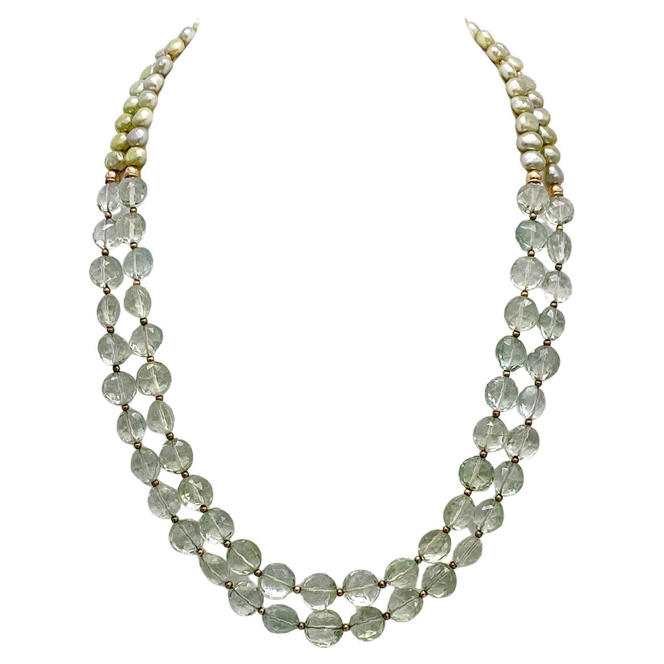 Abbiamo creato questa collana a doppio filo di Prasiolite (ametista verde) con gemme traslucide sfaccettate di 10 mm e perle verde menta di 7 mm, oltre a una chiusura a tubo in oro rosa 14K e altri componenti.

La nostra collezione di gioielli