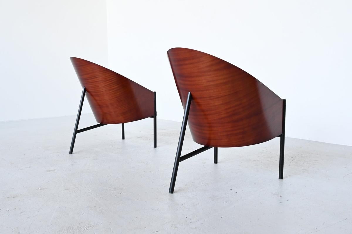 Beautiful pair of Philippe Starck's iconic Pratfall armchairs in mahogany veneer. Early 90s edition. Derived from the smaller and narrower Costes model, the Pratfall adorned the desk of the President of the Republic (F Mitterrand). Very good