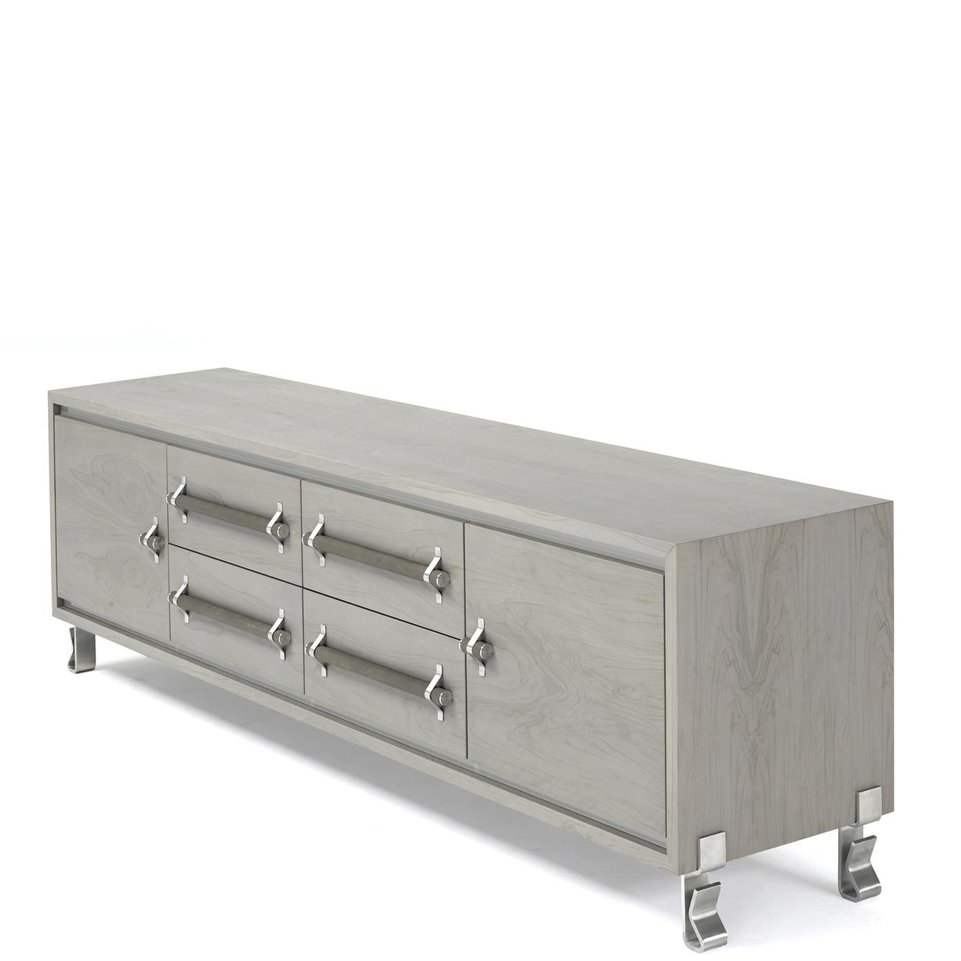 This turtle gray, olive wood media cabinet features gray parapan inserts, two doors, satin stainless steel feet and four drawers covered in genuine leather and equipped with stainless steel handles. This item has a utilitarian industrial look that