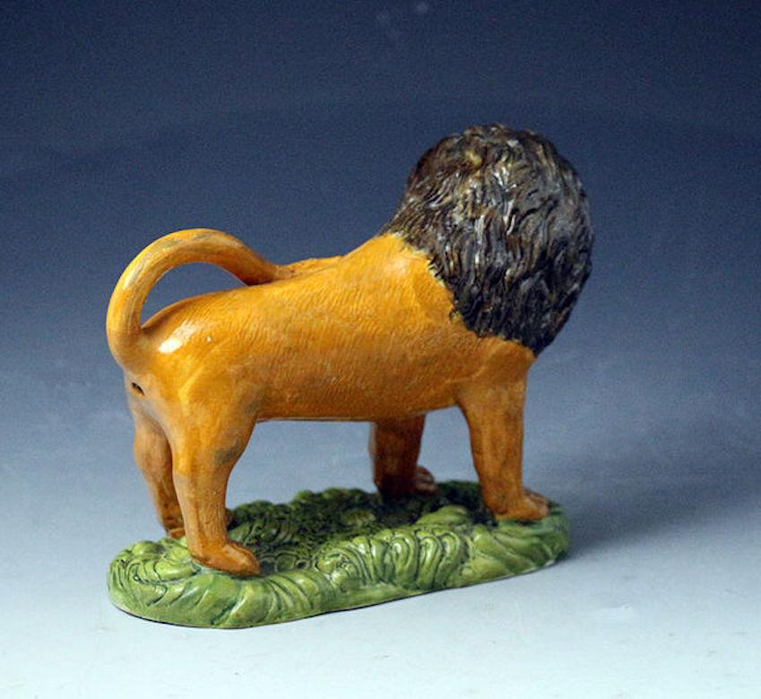 English Prattware Pottery Figure of a Lion on a Grass Base, 19th Century For Sale