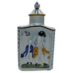 Prattware pottery ‘Macaroni’ tea caddy and cover, c. 1800.