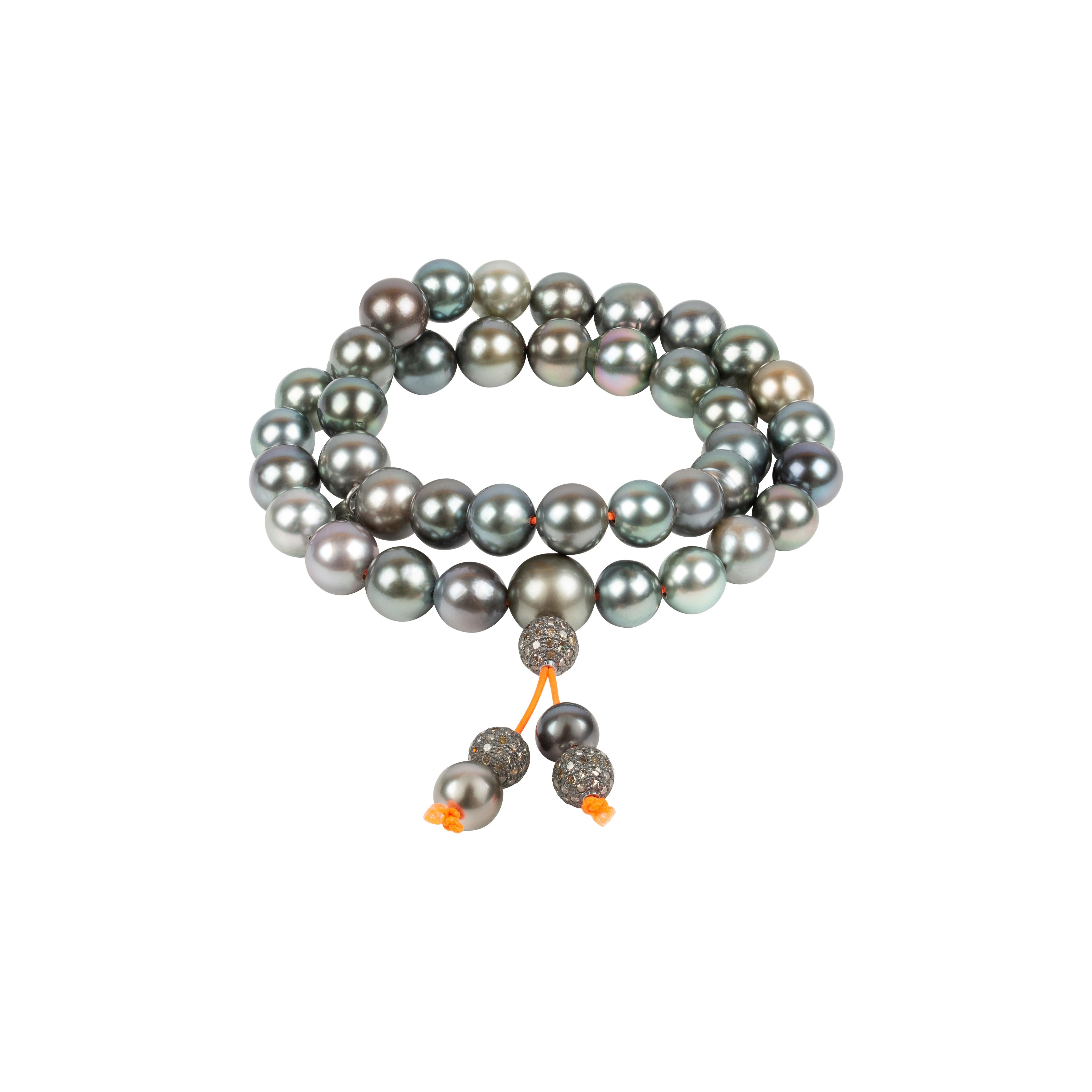 This special jewelry piece is inspired by the Buddhist prayer necklaces/ bracelets. 
It can be worn as a shorter necklace or wrapped around the wrist. Its intriguing Tahiti pearls are captivating, its elegance and casualness are amazing and you can