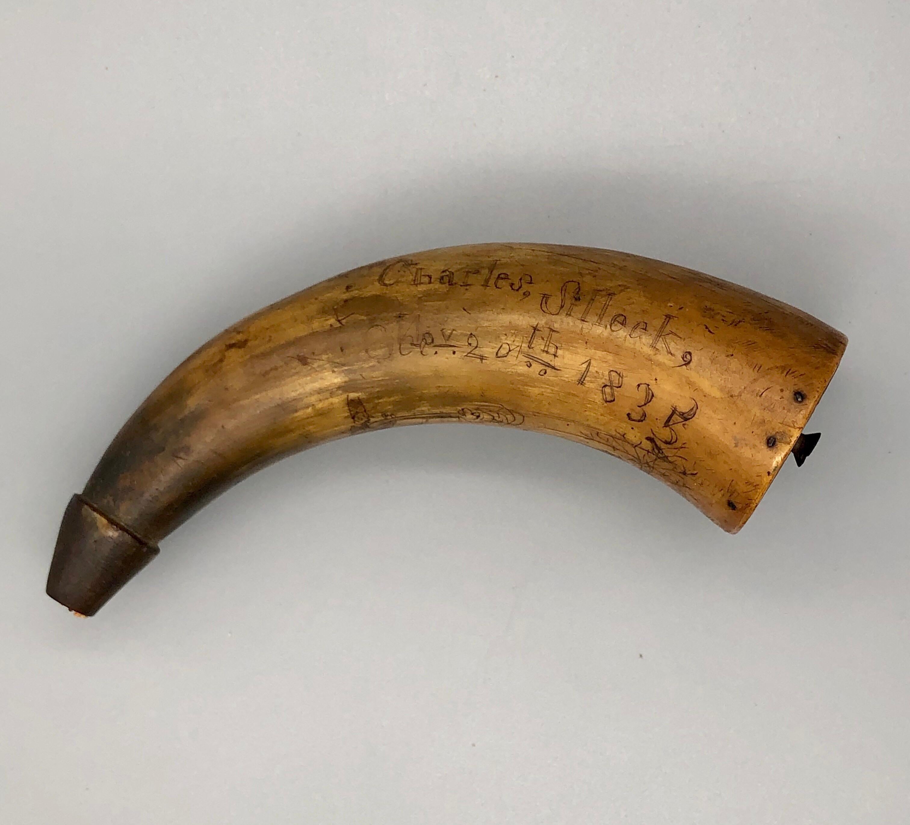 This rare find dates from 1835, nearly 30 years before the American Civil War. The horn is inscribed Charles Silleck, Nov 20th 1835. Below the inscription is a roughly drawn scene of a gentleman shooting a rifle at a bird in a tree, with a dog