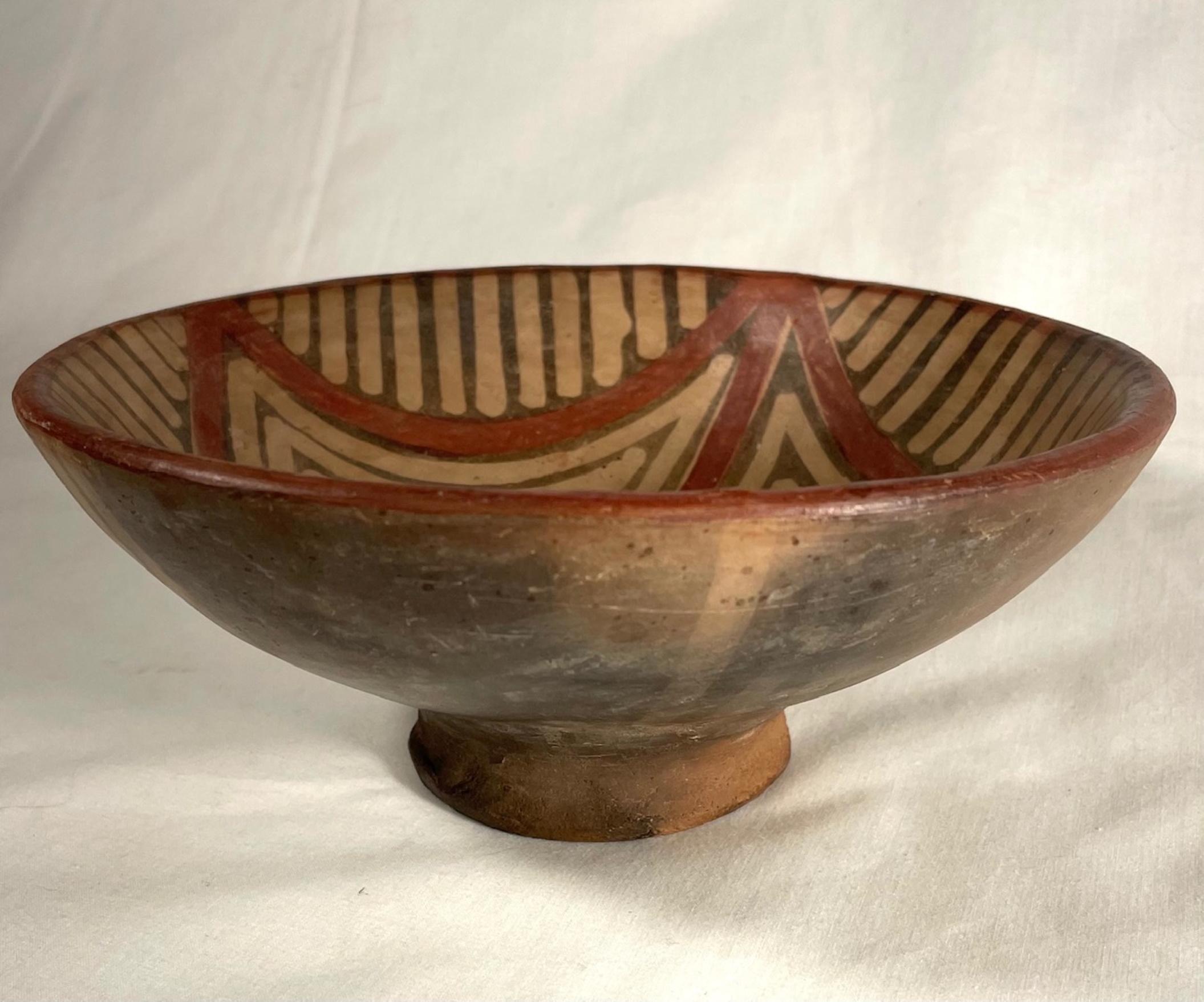 Pre Colombian, Ecuadorian Pottery bowl, Mucawa drinking vessel, Geometric motifs.

This beautiful specimen of geometric shapes is in excellent condition. A footed pottery celebratory drinking bowl vessel (Mucawa) is painted all over with the