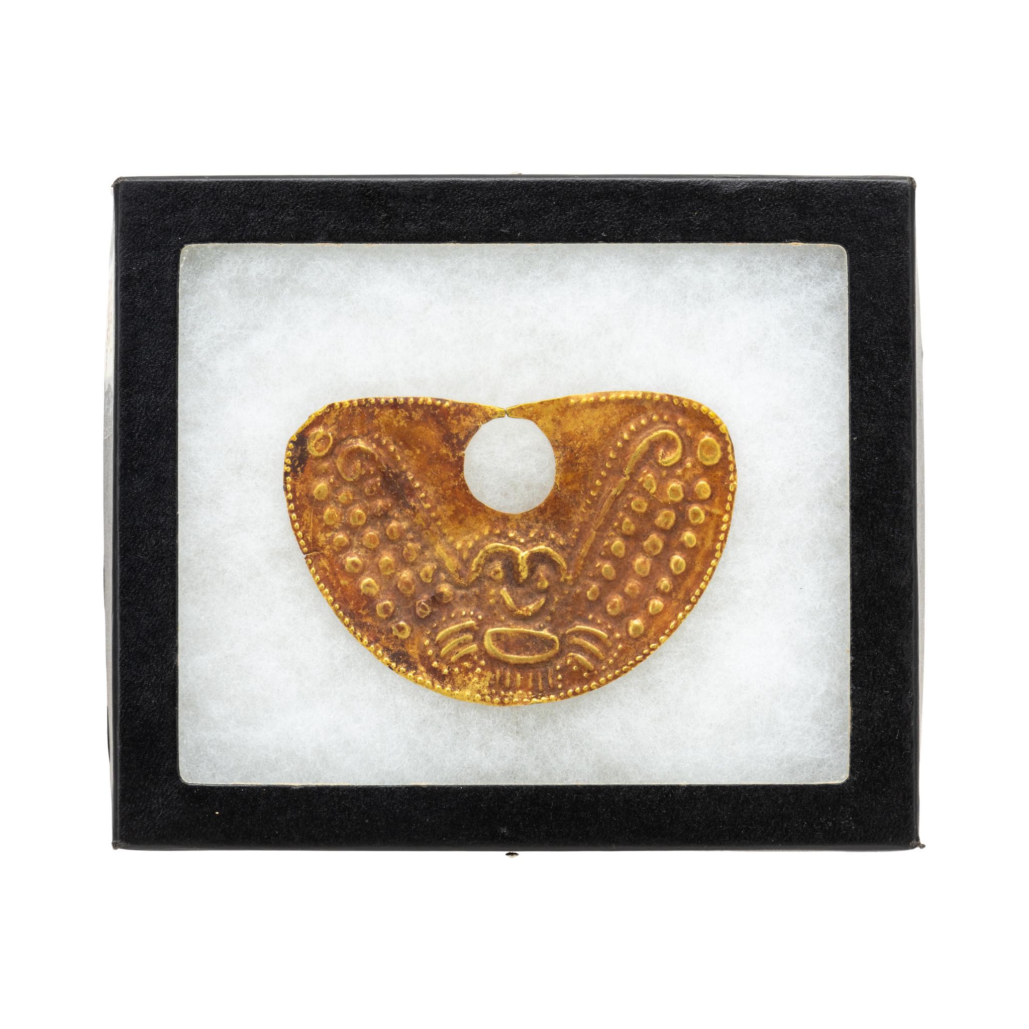 Pre-Columbian 20K Gold Nose Ornament. Decorated 20K gold nose ornament, Moche Period, Peru. 450 - 550 CE. Fascinating and mysteriously designed, repousse decorated Pre-Columbian gold nose ornament found in the Ayabaca Region of Northern Peru in the